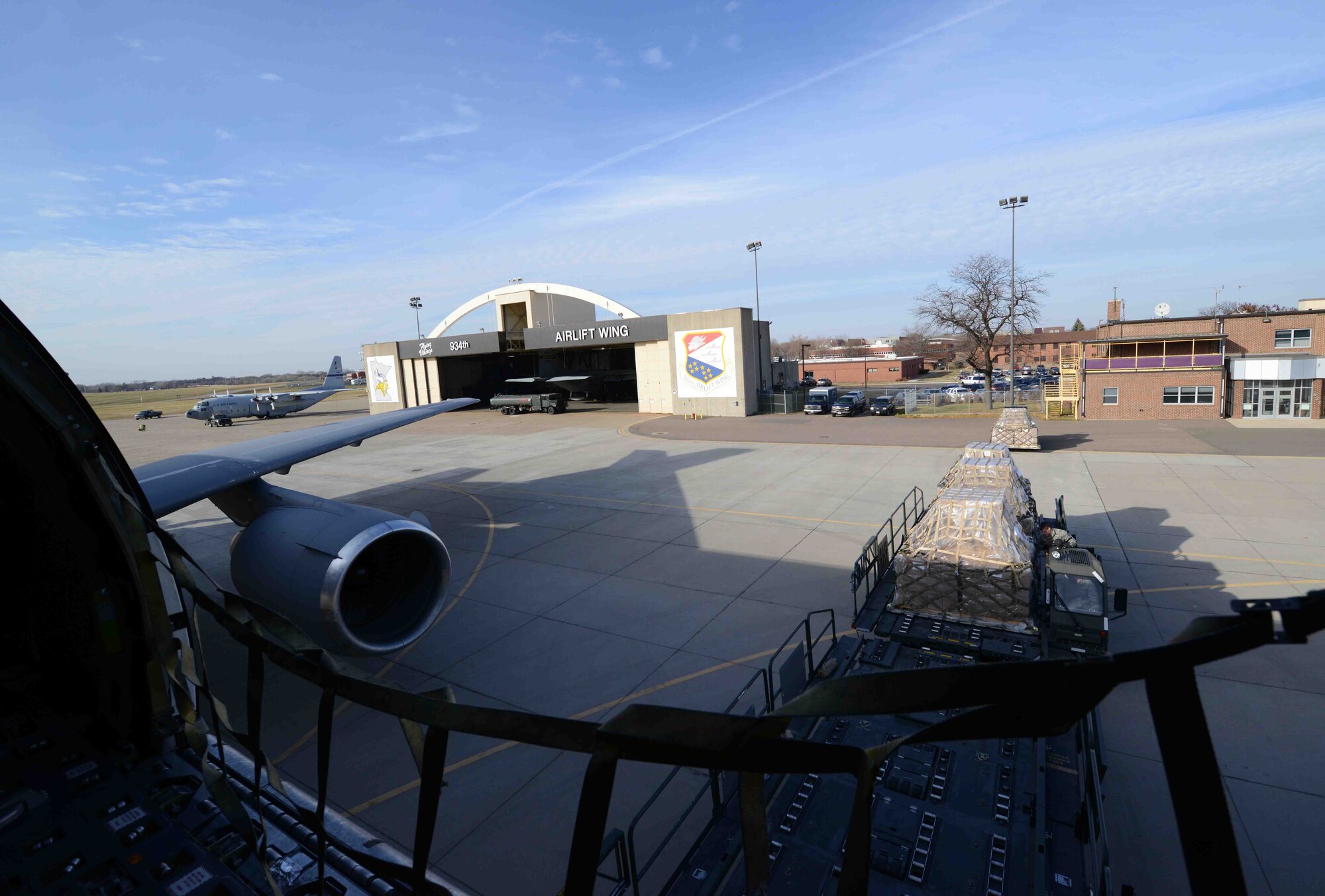 Humanitarian cargo is loaded Nov. 8 as part of the Denton program. (Air Force Photo/Paul Zadach)
