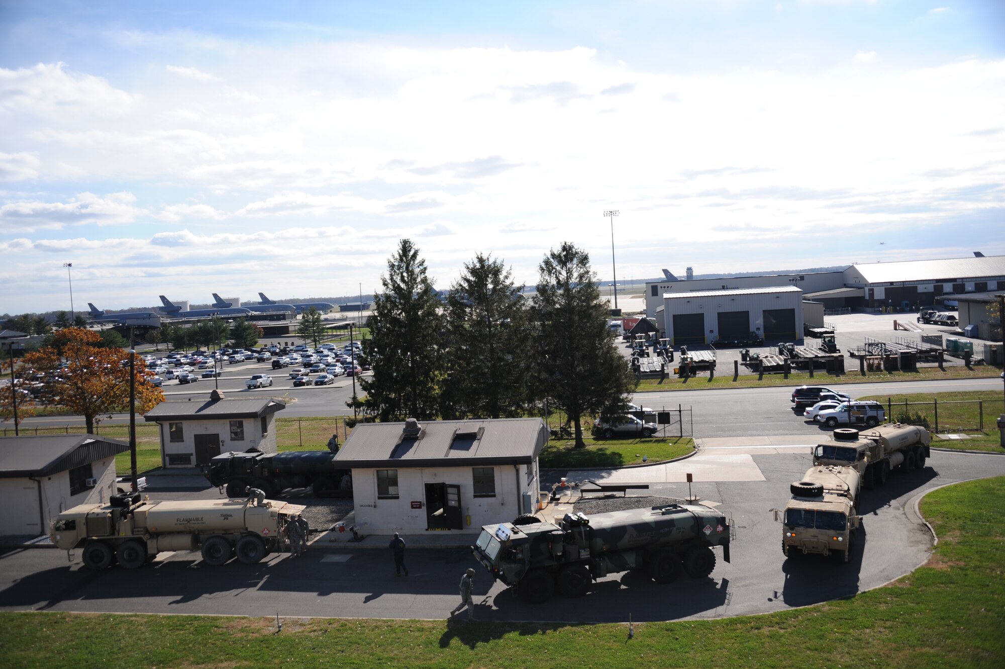 Soldiers from the 710th Brigade Support Battalion out of Fort Drum, N.Y., work with Airmen from the 87th Logistics Readiness Squadron Fuels Management Flight, to fill five Hemmets with fuel at Joint Base McGuire-Dix-Lakehurst, N.J. Nov. 6, 2012. The Soldiers are delivering the fuel to regions around New York and New Jersey for Hurricane Sandy relief efforts. 

(U.S. Air Force photo by 2nd Lt. David J. Murphy/Released)