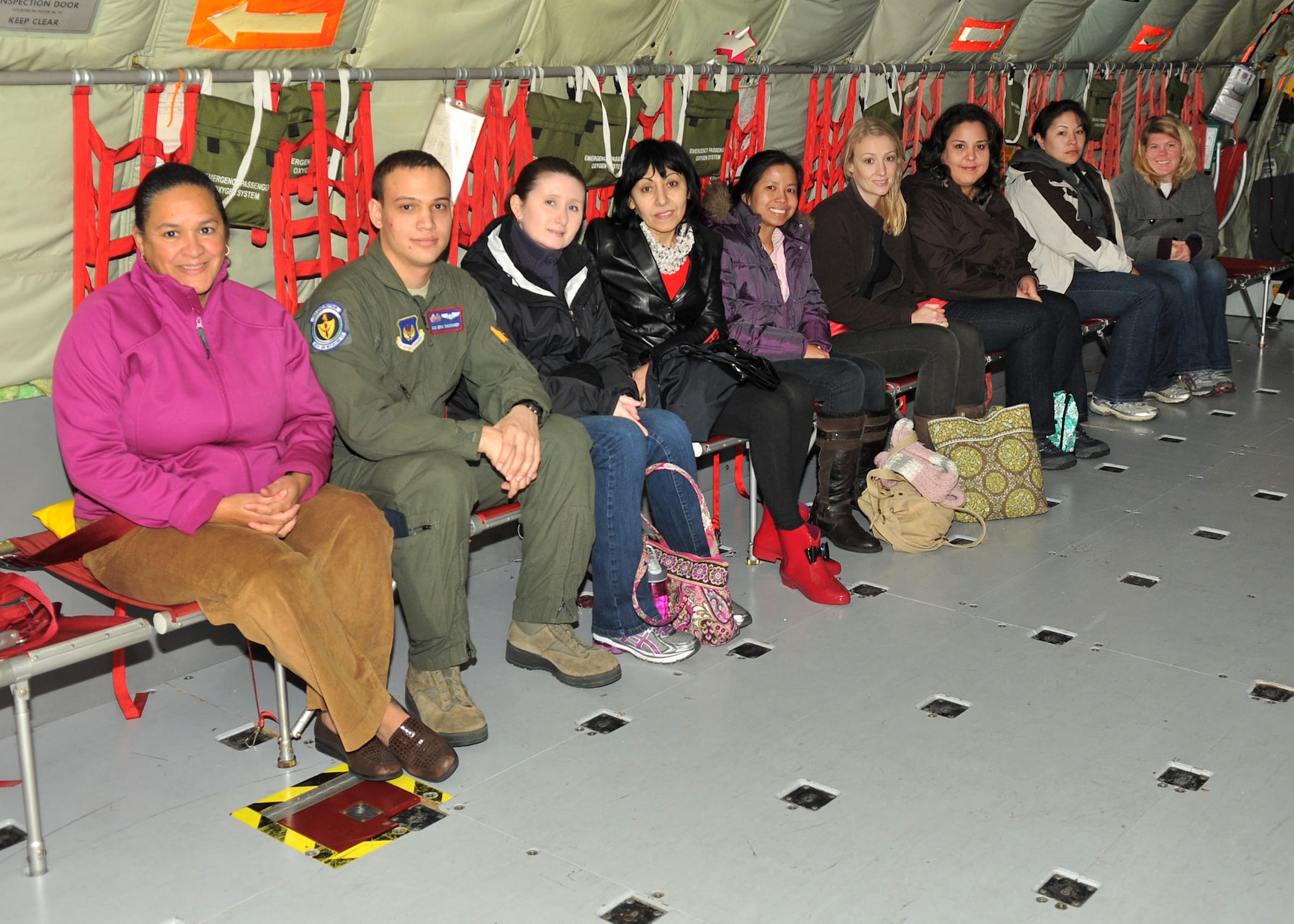 Spouses from the 100th Air Refueling Wing staff agencies take part in a spouse orientation flight on board a KC-135 Stratotanker Nov. 14, 2012, at RAF Mildenhall, England. The spouses were invited to take part in the flight to gain more insight to the base’s mission. (U.S. Air Force photo by Senior Airman Jerilyn Quintanilla/Released)