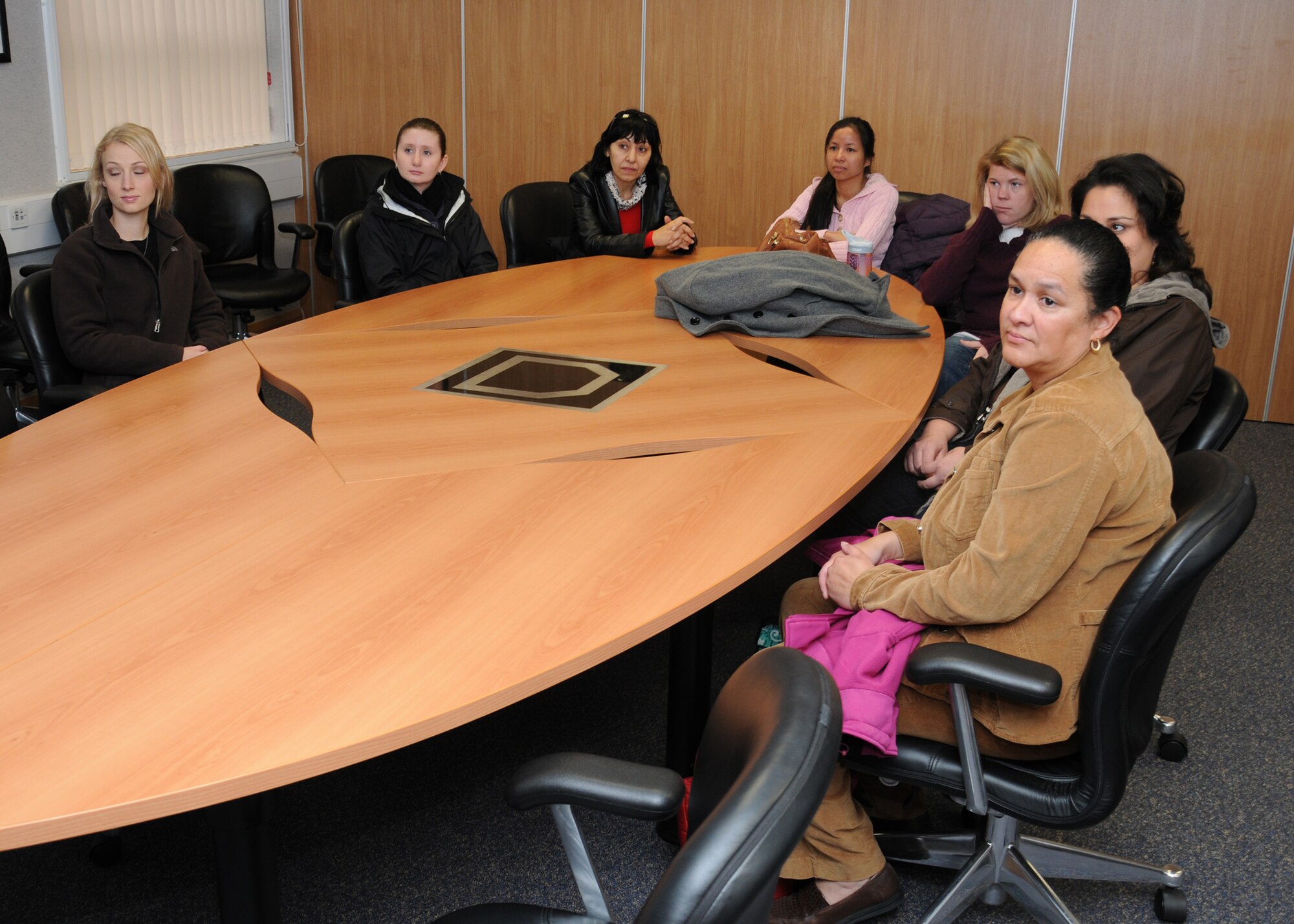 Spouses from the 100th Air Refueling Wing staff agencies listen to a “Pass the Gas” briefing Nov. 14, 2012, at RAF Mildenhall, England. The briefing took place prior to a spouses’ orientation flight. (U.S. Air Force photo by Gina Randall/Released)