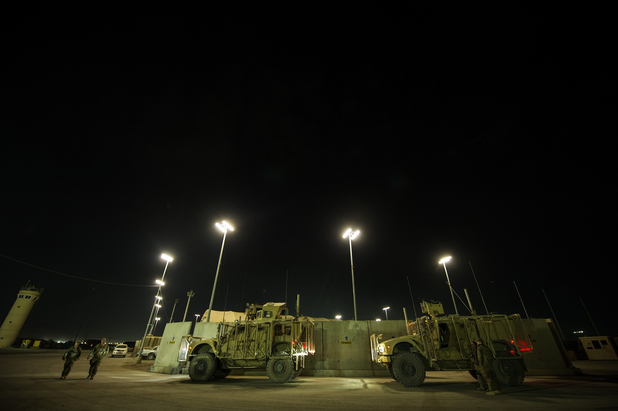 455th Expeditionary Security Forces Squadron Airmen unload gear from a Mine-Resistant, Ambush-Protected, All-Terrain Vehicle after returning from a mission Oct. 24, 2012, at Bagram Airfield, Afghanistan. 455th ESFS regularly have teams patrol "outside the wire" around the base perimeter looking for suspicious activity and visiting local villages to strengthen working relations with the locals. (U.S. Air Force photo/ Staff Sgt. Jonathan Snyder)(RELEASED)