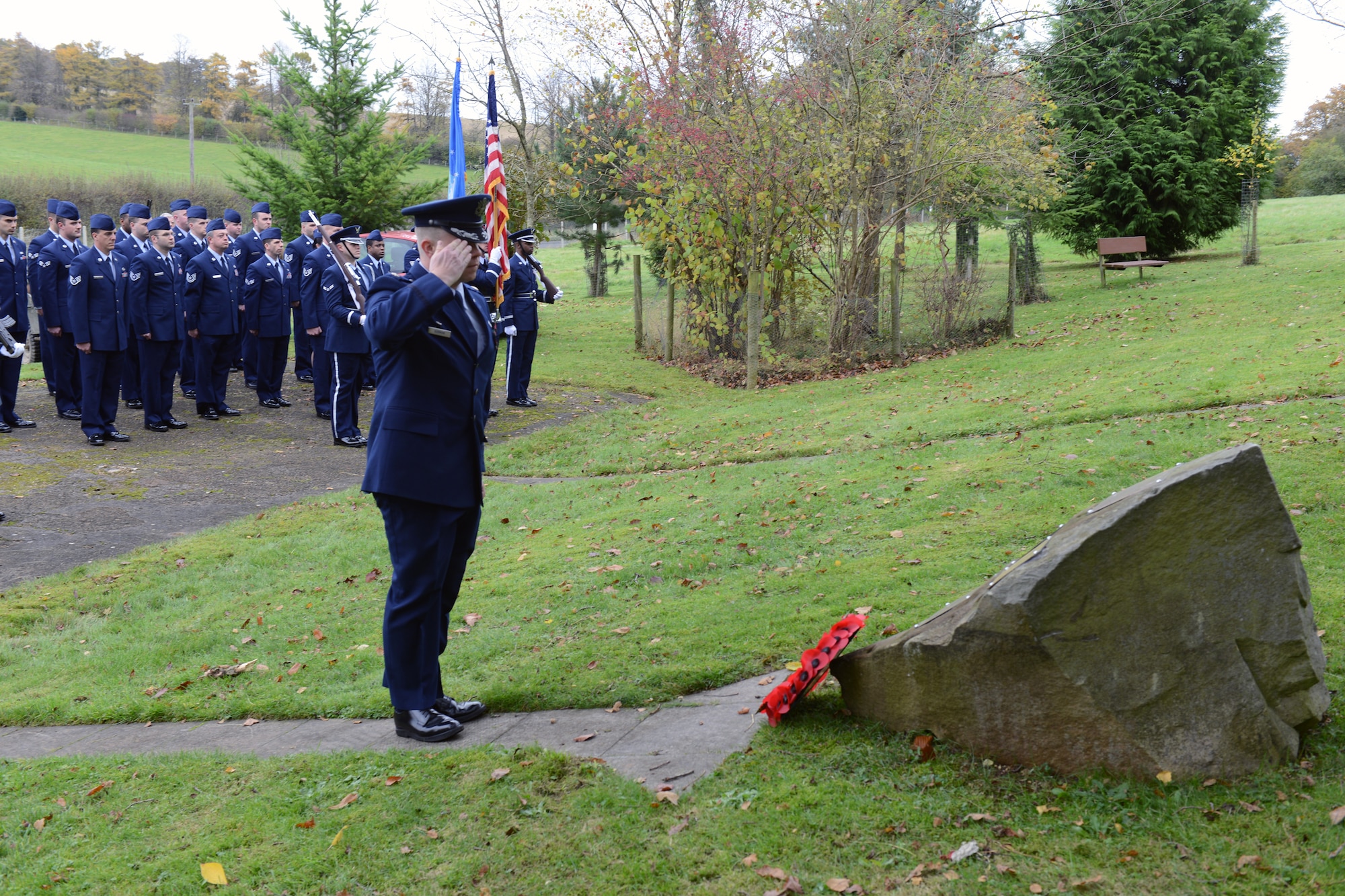 RAF WELFORD, United Kingdom – Maj. Steven Gorman, 420th Munitions Squadron commander, salutes after placing a wreath at the base of the Sarcen Stone, which carries commemorative plaques to a number of important Welford anniversaries, during a remembrance ceremony at RAF Welford’s Memorial Grove Nov. 9. The remembrance service is held as close as possible to National Remembrance Sunday. (U.S. Air Force photo by Staff Sgt. Brian Stives)