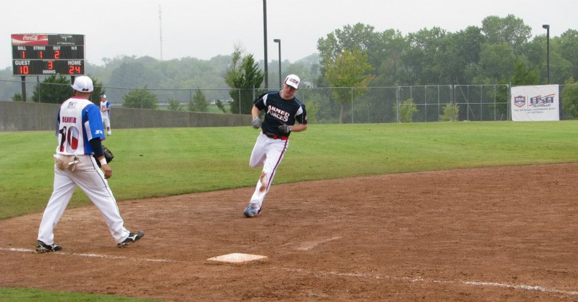 Airman 1st Class John Allen, 606th Air Control Squadron radio frequency transmission systems technician from Smyrna, Tenn., runs to third base during a European Championship softball game in Granfenwoehr July 7, 2012. Allen batted 5-5 and hit two home runs during this game. He made the U.S. Air Force softball team shortly after participating in this game. (U.S. Air Force courtesy photo/released)