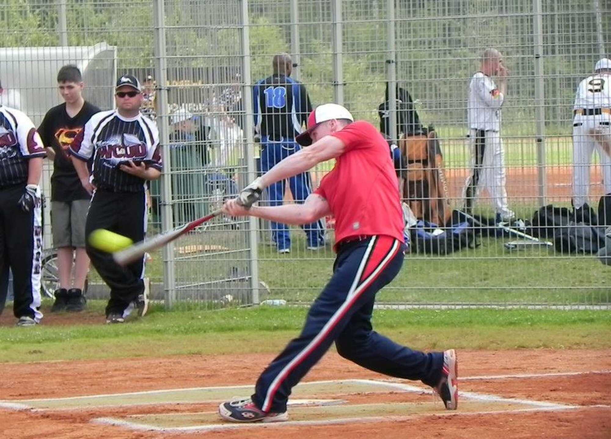 OKLAHOMA CITY-- Airman 1st Class John Allen, 606th Air Control Squadron radio frequency transmission systems technician from Smyrna, Tenn., hits a triple during the Amateur Softball Association Class-A National Championship in Oklahoma City Sept. 29, 2012. During this game, Allen played for the All-Armed Forces softball team, which he was picked up for Sept. 21, 2012. The Armed Forces team lost 30-15. (U.S. Air Force courtesy photo/released)