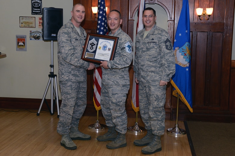 RAF ALCONBURY, United Kingdom – Senior Master Sgt. Gene Eastman, 501st CSW Regional Contracting Office chief, receives his certificate announcing his selection to promotion to chief master sergeant from Col. Michael Reiner, 423rd Air Base Group commander, during the chief master sergeant selection ceremony at the Stukeley Inn on RAF Alconbury November 9. Three senior master sergeants from within the 501st Combat Support Wing were part of the more than 450 senior master sergeants from across the Air Force recently selected for promotion to chief master sergeant. (U.S. Air Force photo by Staff Sgt. Brian Stives)