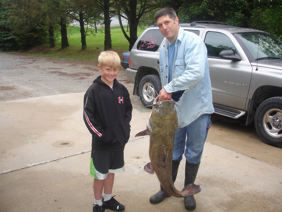 Father and Son with catfish