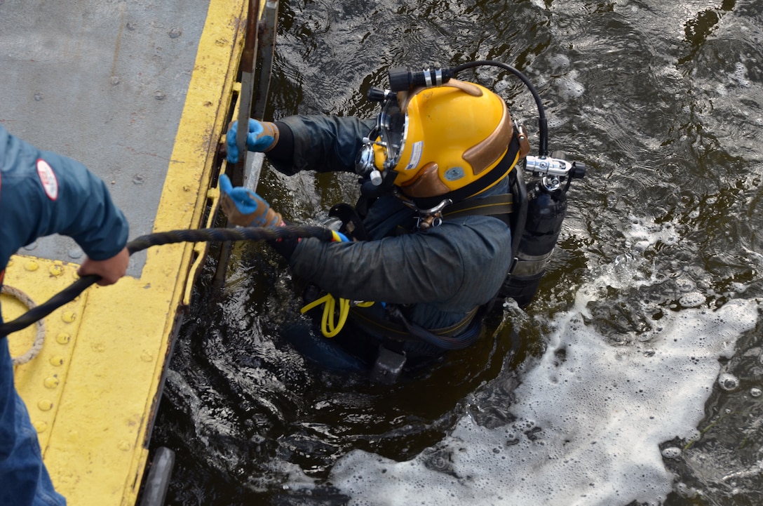 MINNESOTA CITY, Minn.—Nate Van Loon, U.S. Army Corps of Engineers, St. Paul District, diver, conducts periodic inspections at Lock and Dam No. 5 on the Mississippi River near Minnesota City, Minn., Sept. 18. The Corps’ divers work in very low visibility and feel their way around the entire structure. The inspections are a part of the Corps’ effort to maintain the 9-foot navigation channel at the 13 locks and dams within the district’s boundaries. Keeping this system open is vital to the nation’s economy.  In 2010, 16.2 million tons of commodities were shipped on the Mississippi River within the St Paul District’s area of operation, including 8 million tons of grain grown in the Upper Midwest. The industries making these shipments saved nearly $384 million by using the inland waterways instead of overland shipping methods.
