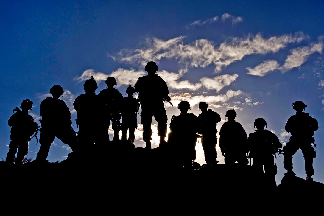 Soldiers watch troop movements during Green Flag-West 13-2 at the National Training Center, Fort Irwin, Calif., Nov. 7, 2012. The soldiers, assigned to the 1st Brigade, Fort Carson, Colo., took part in a three week pre-deployment training exercise.