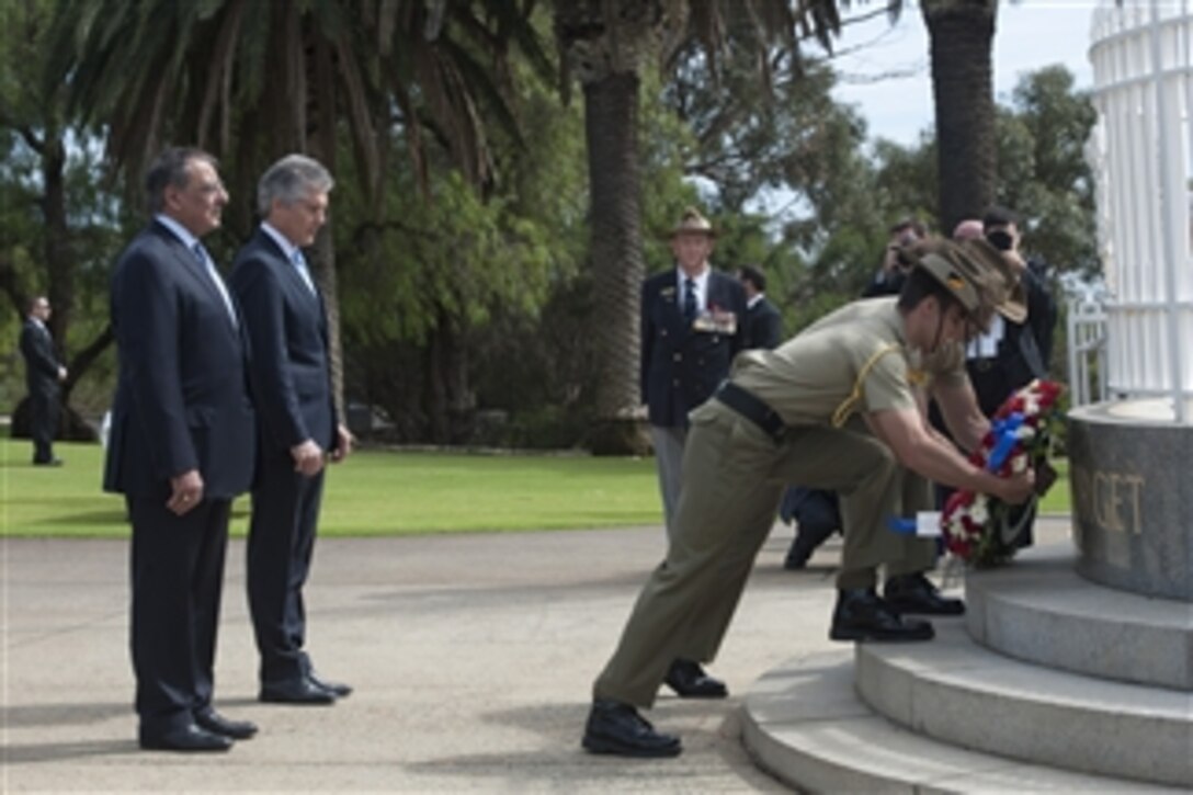 Secretary of Defense Leon E. Panetta, left, stands with Australian Minister for Defence Stephen Smith during a wreath laying ceremony at Kings Park in Perth, Australia, on Nov. 14, 2012.  Panetta is in Perth for the annual ministerial consultations between the United States and Australia.  