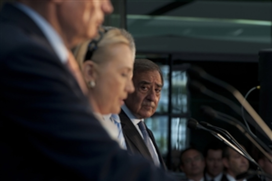 Secretary of Defense Leon E. Panetta listens to Secretary of State Hillary Clinton as she speaks during a joint press conference with Australian Minister for Defence Stephen Smith and Australian Minister for Foreign Affairs Bob Carr during the Australia-U.S. ministerial consultations in Perth, Australia, on Nov. 14, 2012.  