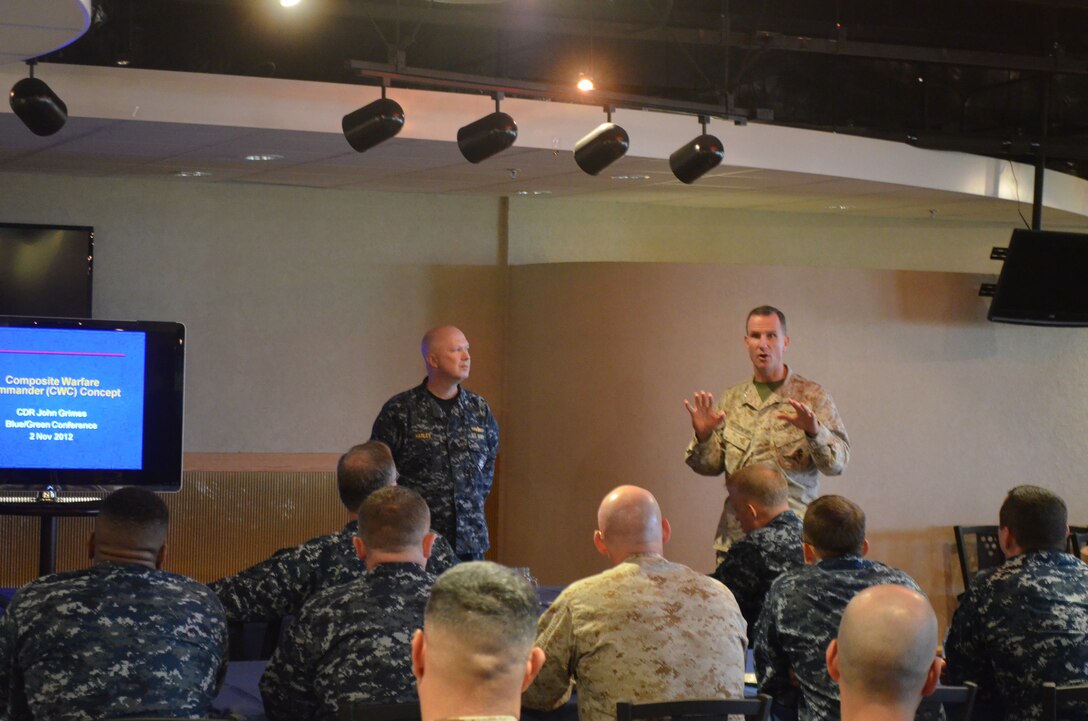 Rear Adm. Jeffrey A. Harley and Col. John A. Ostrowski discuss joint integration and interoperability with members of Expeditionary Strike Group 7 and 3rd Marine Expeditionary Brigade at White Beach Nov. 2. Members of ESG 7 taught a class on the composite warfare commander concept and discussed joint interoperability and planning considerations for when the Navy and Marine Corps work together. The 3rd MEB is a scalable, middleweight force that a commander can tailor to efficiently meet the needs of a mission. Meetings like this improve Navy and Marine Corps interoperability and increase readiness and the ability to respond to a variety of crises and disasters while building professional and personal relationships between the two commands. Harley is the commander, ESG 7. Ostrowski is the chief of staff of 3rd MEB.