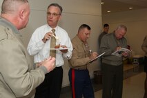 The 2012 Chili Cook-Off in Aviation Hallway is judged.