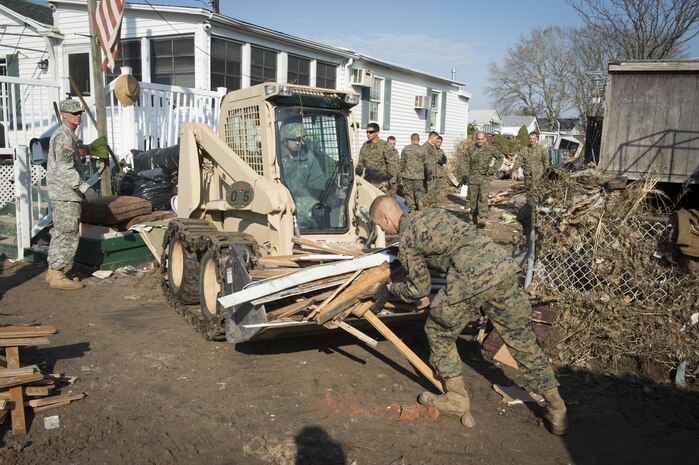 NEW YORK (Nov. 11, 2012) - Marines from the 8th Engineering Support Battalion (8th ESB) from Camp Lejeune, N.C. and Soilders from the 19th engineer battalion from Fort. Knox, Ky., spend Veteran’s Day weekend continuing relief efforts for New York residents impacted by Hurricane Sandy.  Hurricane Sandy was the largest Atlantic hurricane on record and caused the most damage in New York and New Jersey Oct. 29, 2012.  (U.S. Navy photo by Chief Mass Communication Specilalist Ryan J. Courtade/Released)