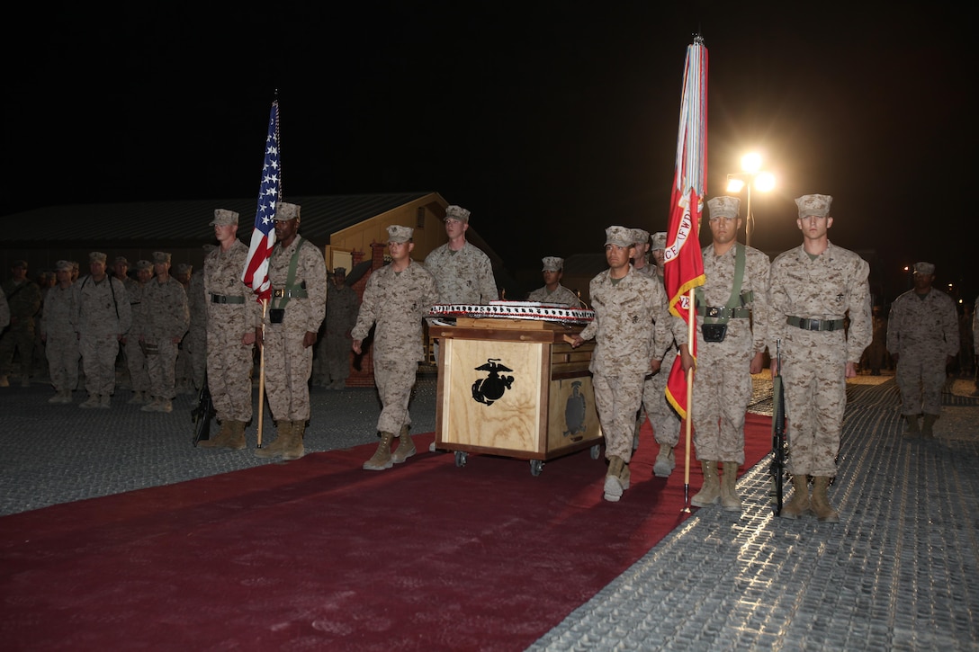 Marines wheel out a cake during Regional Command (Southwest)'s cake cutting ceremony in honor of the 237th Marine Corps Birthday, Nov. 10, 2012, aboard Camp Leatherneck, Afghanistan.
