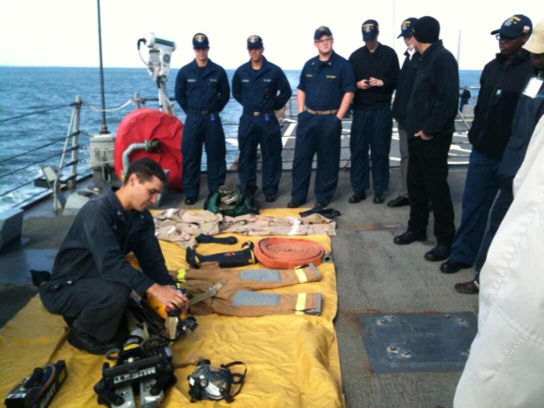 Sailors aboard the USS Mahan review some of the ship’s safety equipment during a training period held for logistics specialists with Medical Logistics Company, 2nd Supply Battalion, 2nd Marine Logistics Group Oct. 14-28, 2012. Two logistics specialists with the company took part in the training, which represented a unique opportunity to experience the specific challenges of living and handling supplies aboard a Navy ship. 