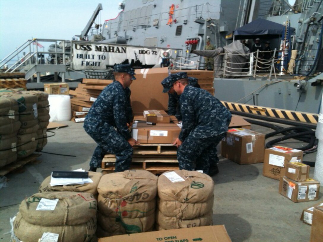 Sailors with the USS Mahan load supplies into the ship during a training period held for logistics specialists with Medical Logistics Company, 2nd Supply Battalion, 2nd Marine Logistics Group Oct. 14-28, 2012. The training represented a unique opportunity for the company’s sailors to work directly with Navy logistics specialists aboard a ship. 