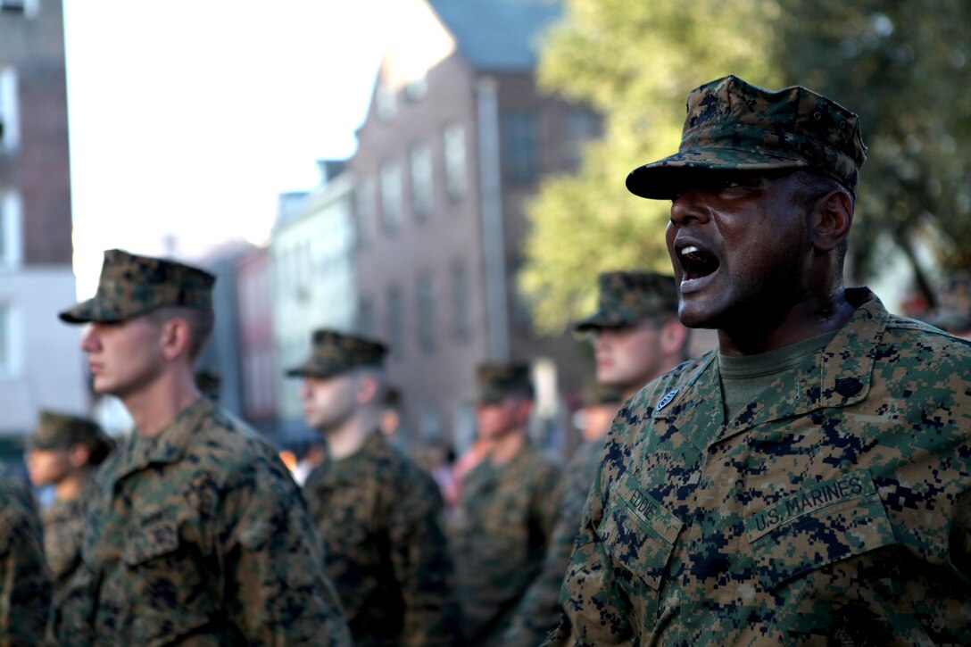 Gunnery Sgt. Derrick Eddie, training chief for the Marine Information Technology Service Center for Marine Forces Reserve, calls a cadence while marching Marines during Louisiana's bicentennial military parade Nov. 10. More than 150 Marines marched through the streets of downtown New Orleans to celebrate the state's bicentennial as well as Veterans Day and the 237th Marine Corps birthday. 