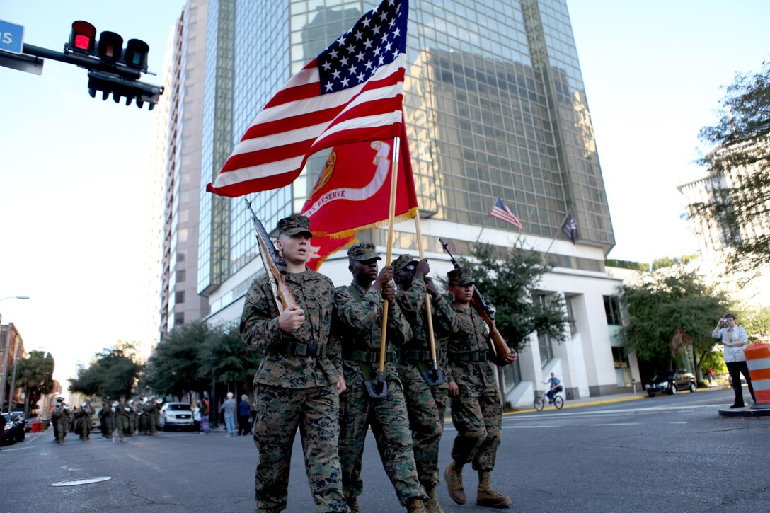 The Marine Forces Reserve colorguard led a contingent of MARFORRES Marines through the streets of New Orleans Nov. 10, as a part of Louisiana's bicentennial military parade. The Marines were not only celebrating the bicentennial, but Veterans Day and the birthday of the Marine Corps as well. More than 150 Marines participated in the parade as thousands of New Orleanians cheered from the roadsides.