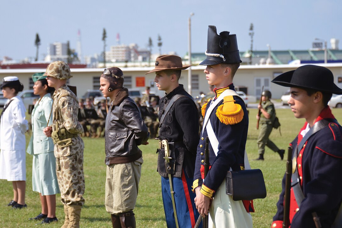 Members of the Kubusaki High School Junior Reserve Officers' Training Corps model historic Marine Corps uniforms at the Marine Corps birthday pageant at the Camp Foster parade field Nov. 9. The various uniforms represented different eras from Marine Corps history. 