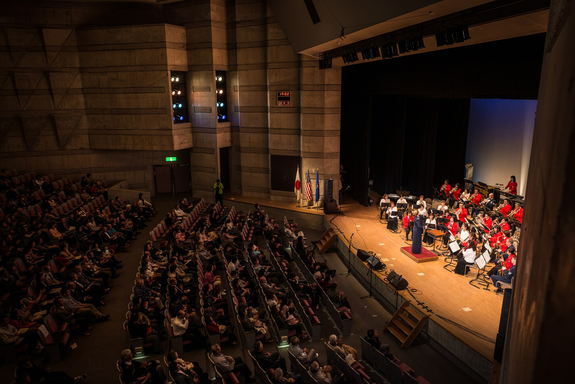 MIZUHO TOWN, Japan -- Capt. Haley Armstrong, Band of the Pacific commander, conducts an encore performance of the bilateral concert band during the annual Goodwill Concert at the Mizuho Viewpark Sky Hall in Mizuho Town, Japan, Nov. 10, 2012. This annual concert fosters relations with the Mizuho Town community next to Yokota Air Base through the universal language of music. (U.S. Air Force photo by Tech. Sgt. Samuel Morse)