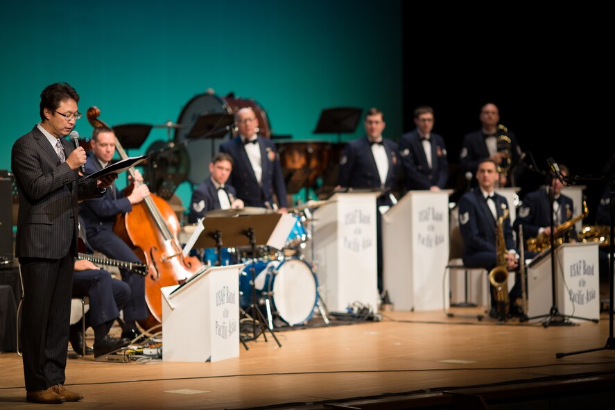 MIZUHO TOWN, Japan -- Masato Yagi, Band of the Pacific-Asia community relations specialist, announces the next song during the annual Goodwill Concert at the Mizuho Viewpark Sky Hall in Mizuho Town, Japan, Nov. 10, 2012. Yagi has been the Japanese voice of the Band of the Pacific-Asia for the last 12 years, bridging the inherent language barrier with the audience. (U.S. Air Force photo/Staff Sgt. Josh Voyles)