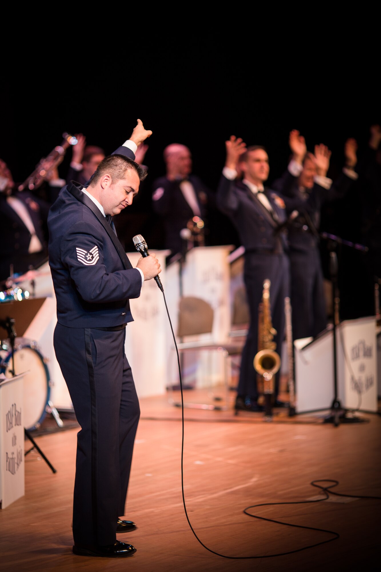 MIZUHO TOWN, Japan -- Tech. Sgt. Justin Allen, Band of the Pacific-Asia vocalist, sings and dances during the annual Goodwill Concert at the Mizuho Viewpark Sky Hall in Mizuho Town, Japan, Nov. 10, 2012. Allen sang, danced and interacted with the audience and band during the show. (U.S. Air Force photo/Staff Sgt. Josh Voyles)