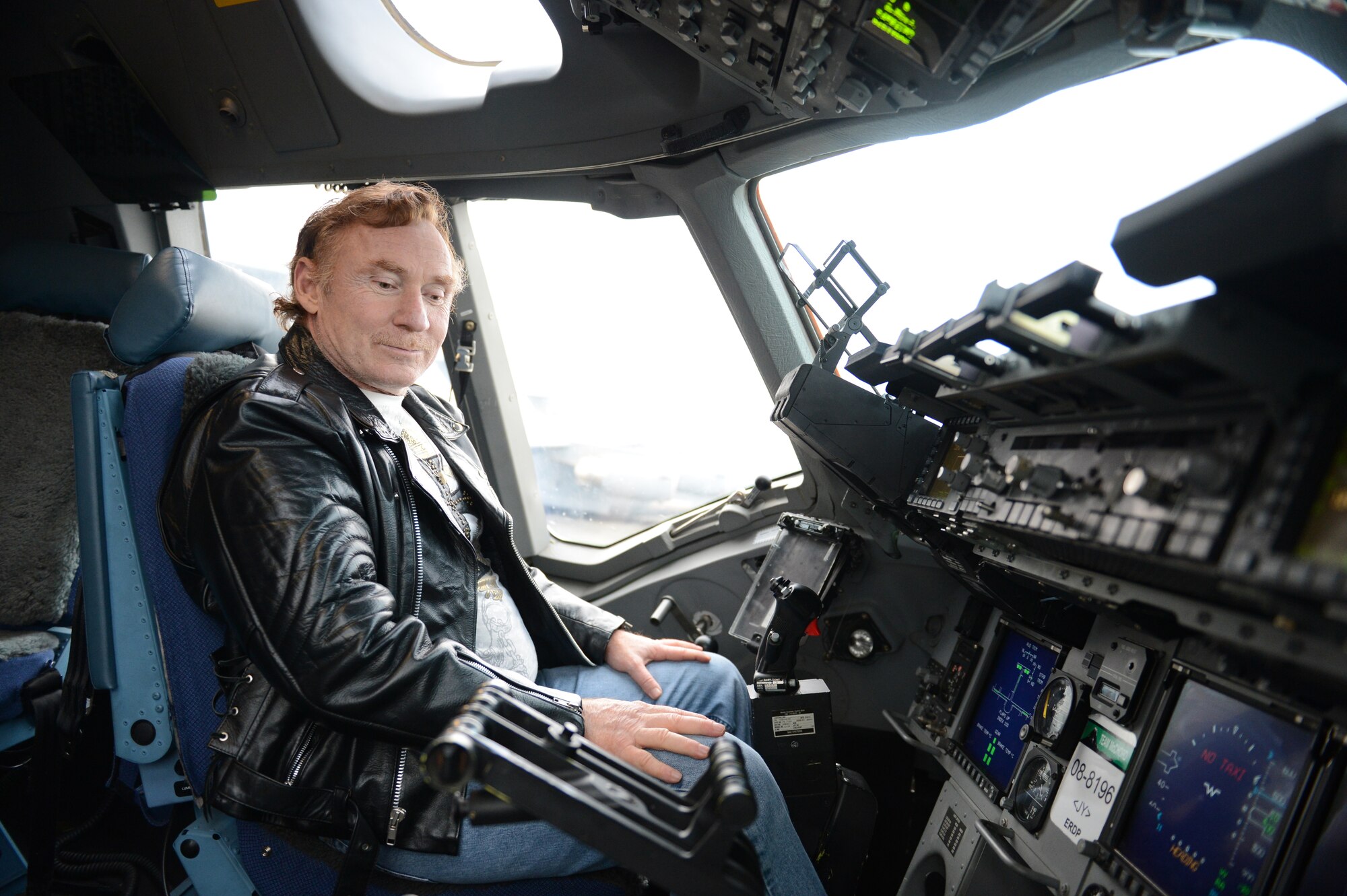 Danny Bonaduce, local radio host for KZOK channel 102.5 FM and former child actor, explores the cockpit of a C-17 Globemaster III aircraft, Nov. 15, 2012 at Joint Base Lewis-McChord, Wash. Bonaduce toured several places on McChord Field including the Western Air Defense Sector, a C-17 static display and the McChord Field control tower. (U.S. Air Force photo/Staff Sgt. Sean Tobin)