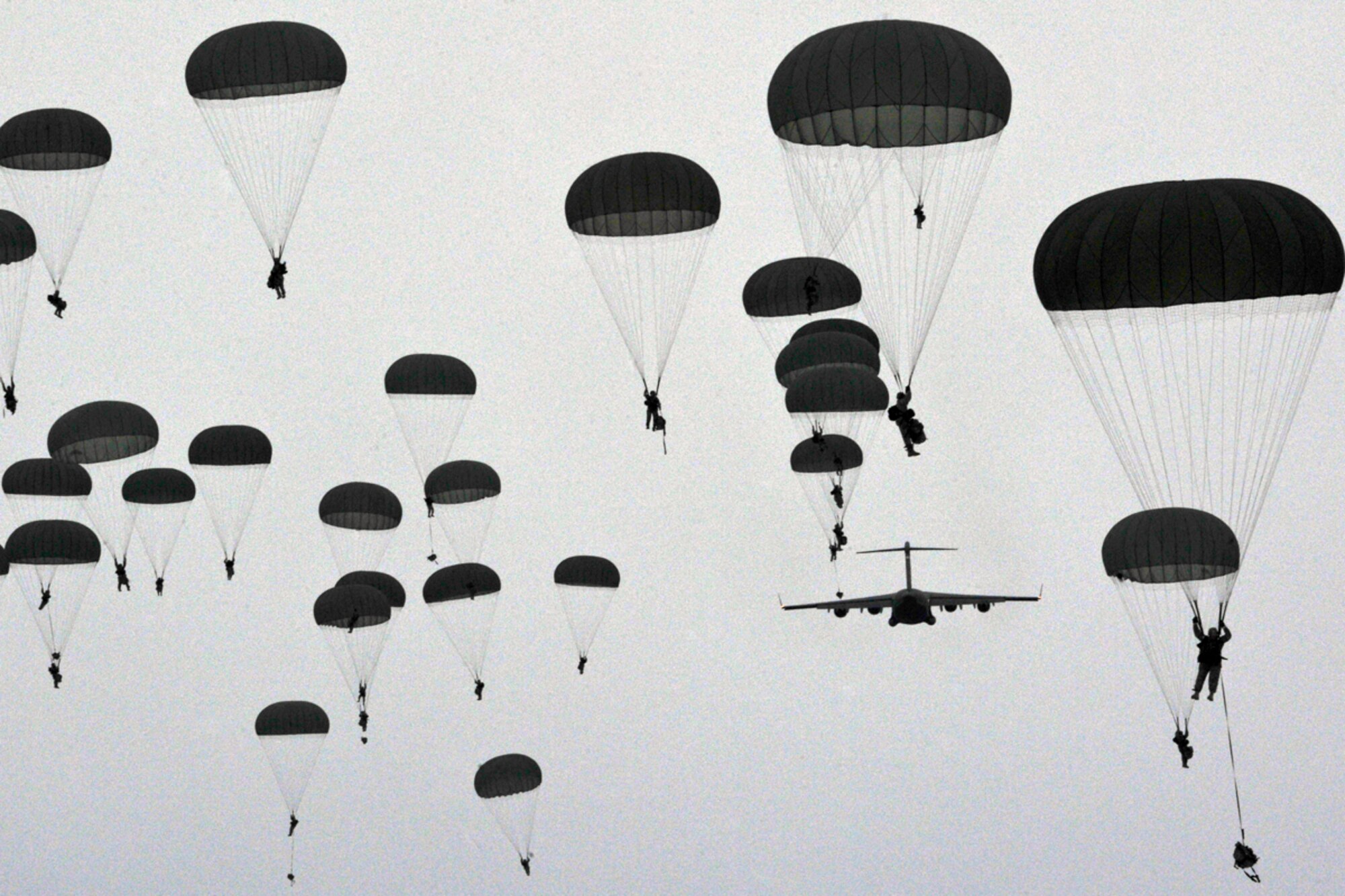 JOINT BASE ELMENDORF-RICHARDSON, Alaska -- Paratroopers of U.S. Army Alaska's 4th Brigade Combat Team (Airborne), 25th Infantry Division conduct a training parachute assault on Malamute Drop Zone on Joint Base Elmendorf-Richardson, Tuesday, Nov. 13, 2012.  The brigade recently returned from a ten-month tour in Afghanistan, and approximately 200 of the unit's Soldiers made the jump into their sub-arctic home installation. (U.S. Air Force photo by Justin Connaher)
