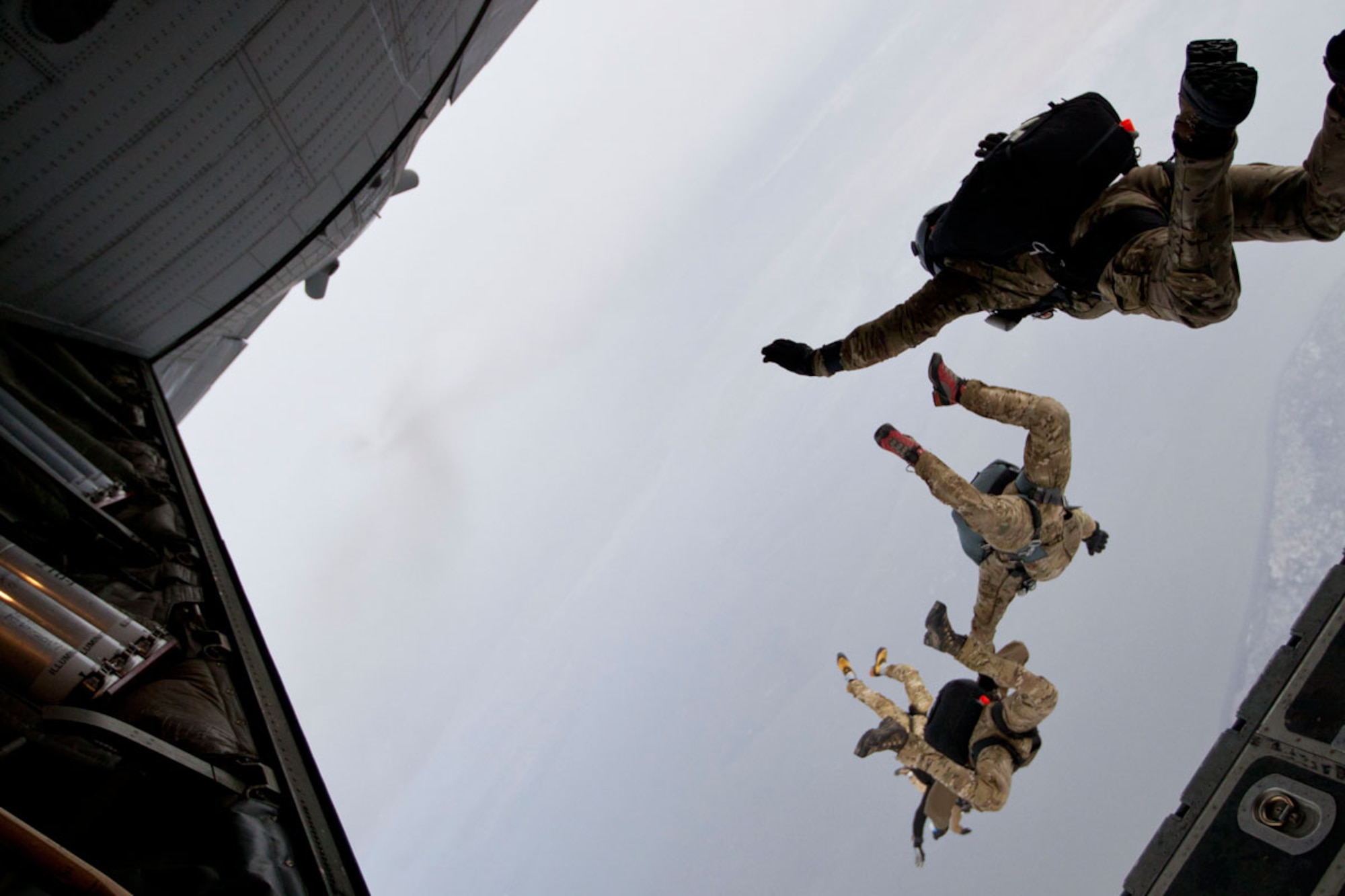 Pararescuemen of the Alaska Air National Guard’s 212th Rescue Squadron perform a free-fall jump over the Malemute Drop Zone on Joint Base Elmendorf-Richardson Oct. 31. 212th RSQ Pararescuemen used this form of insertion to provide medical aid to an Alaska woman. (U.S. Air Force photo/1st Lt. Bernie Kale)