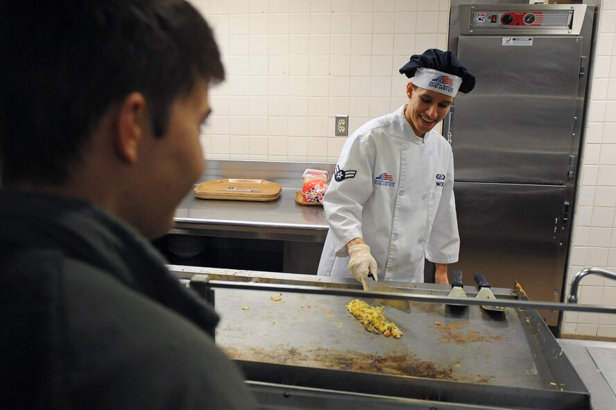 Airman 1st Class Christian Noe, 2nd Force Support Squadron food services apprentice, makes an omelet in the Red River Dining Facility on Barksdale Air Force Base, La., Nov. 15. The Red River Dining Facility offers a wide variety of food for Team Barksdale to enjoy. The dining facilities service hours during weekdays for breakfast are from 6 a.m. to 8 a.m., lunch is served from 11 a.m. to 1 p.m., dinner is served from 5 p.m. to 7 p.m. and midnight dining hours are from 10:30 p.m. to 1 a.m. On weekends and holidays, service hours for breakfast are from 6 a.m. to 10:30 a.m., brunch is served from 10:30 a.m. to 1:30 p.m., dinner is served from 5 p.m. to 7 p.m. and midnight dining hours are from 10:30 p.m. to 1 a.m. (U.S. Air Force photo/Senior Airman Micaiah Anthony)(RELEASED)