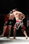Tech Sgt. Angelo Gutierrez, Air Education and Training Command NCO in charge of personal security, fights Cameron Martin for the MMA Premier Combat Group heavyweight championship Jan. 28 at Cowboys Dance Hall. (Courtesy photo)