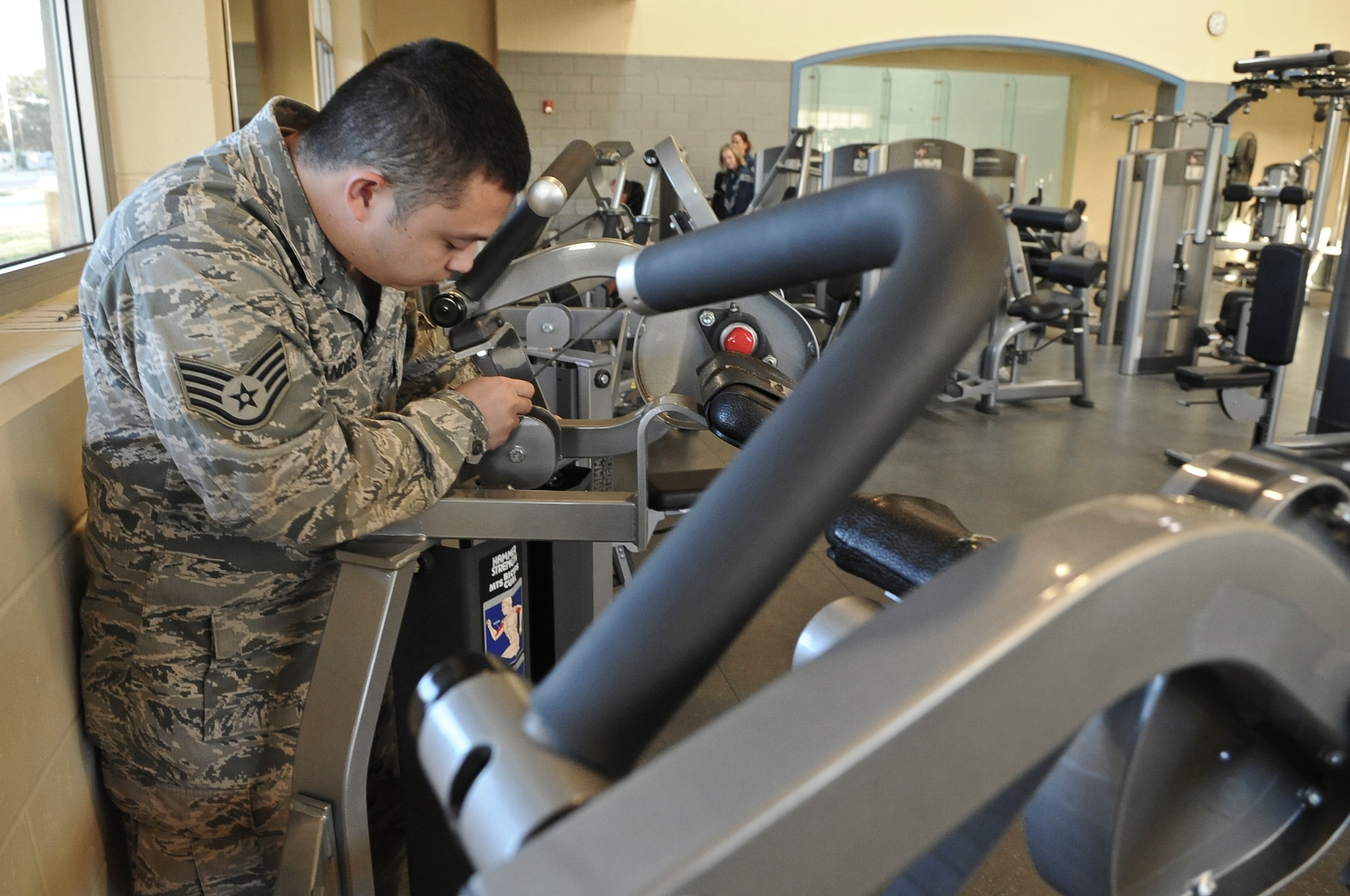 Staff Sgt. Tommie Andres, 2nd Force Support Squadron fitness specialist, inspects an exercise machine on Barksdale Air Force Base, La., Nov. 15. Fitness equipment is checked every day to ensure proper functionality. (U.S. Air Force photo/Senior Airman Micaiah Anthony)(RELEASED)