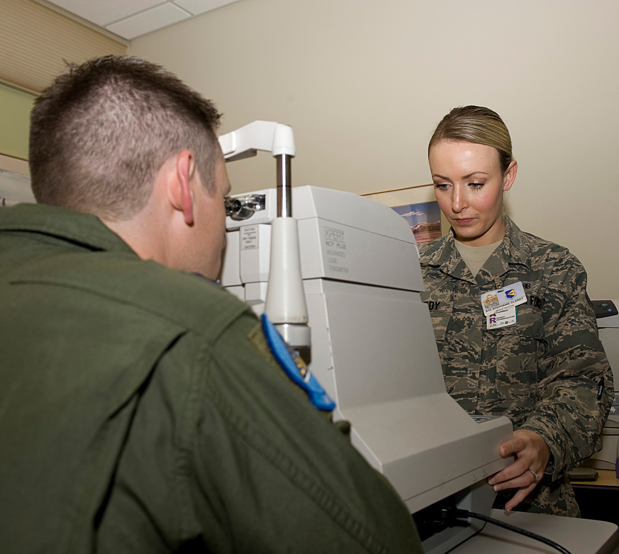 U.S. Air Force Airman 1st Class Stephanie Clardy, 355th Aerospace Medicine Squadron aerospace medicine technician, readies an inner ocular pressure test for a patient on Davis-Monthan Air Force Base, Ariz., Nov. 6, 2012. An inner ocular pressure test is used on pilots to identify if they are pre-glaucomic or has glaucoma. (U.S. Air Force photo by Senior Airman Timothy Moore/Released)