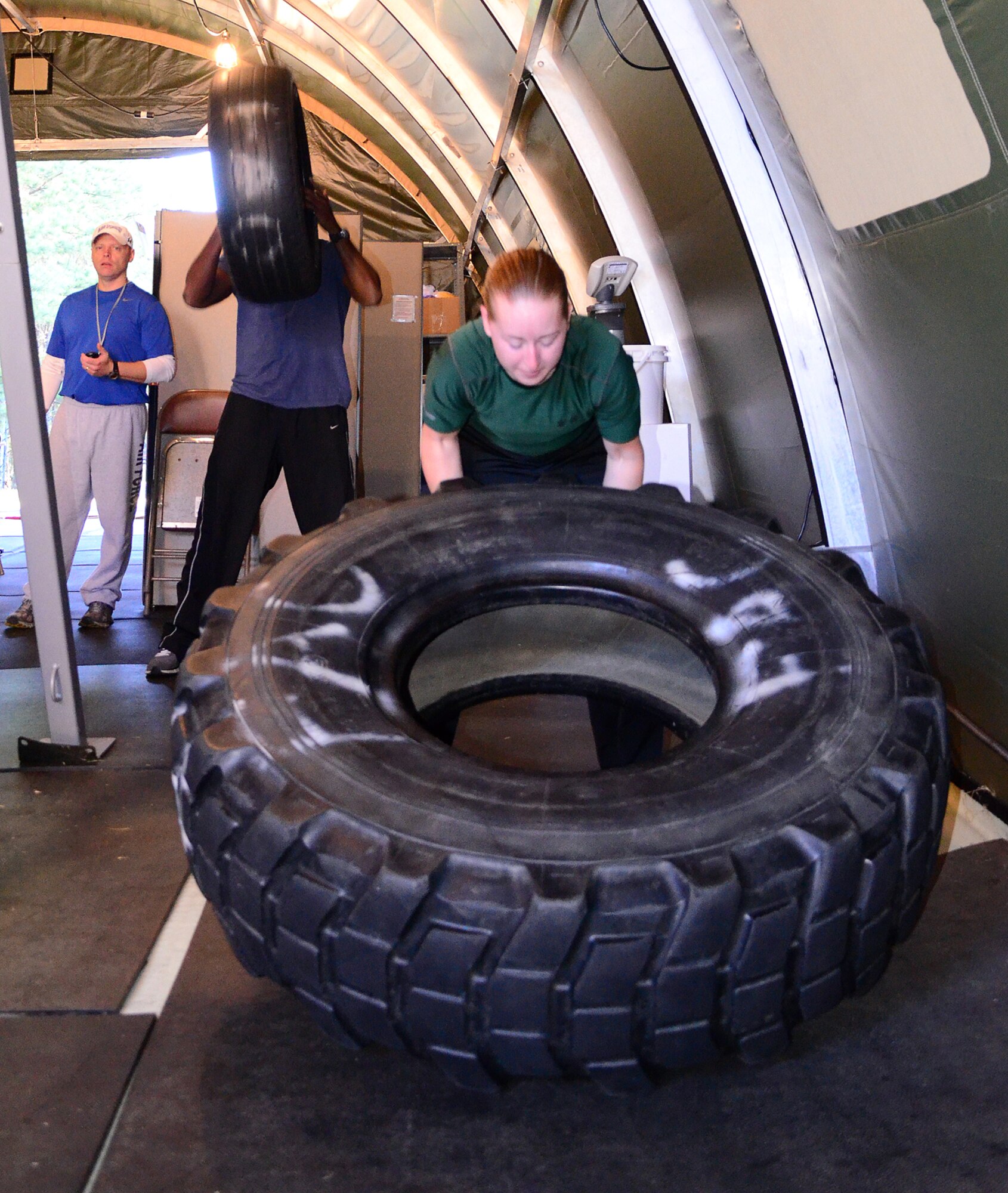John Mikula, Dobbins exercise physiologist, instructs a fitness class and uses the Total Body Resistance Exercise, or TRX, Suspension Training,with endarance training. Mikula offers his strength and conditioning classes for Dobbins members three times a week, on Mondays, Wednesdays and Fridays at 9 a.m. (U.S. Air Force photo/Senior Airman Elizabeth Van Patten)