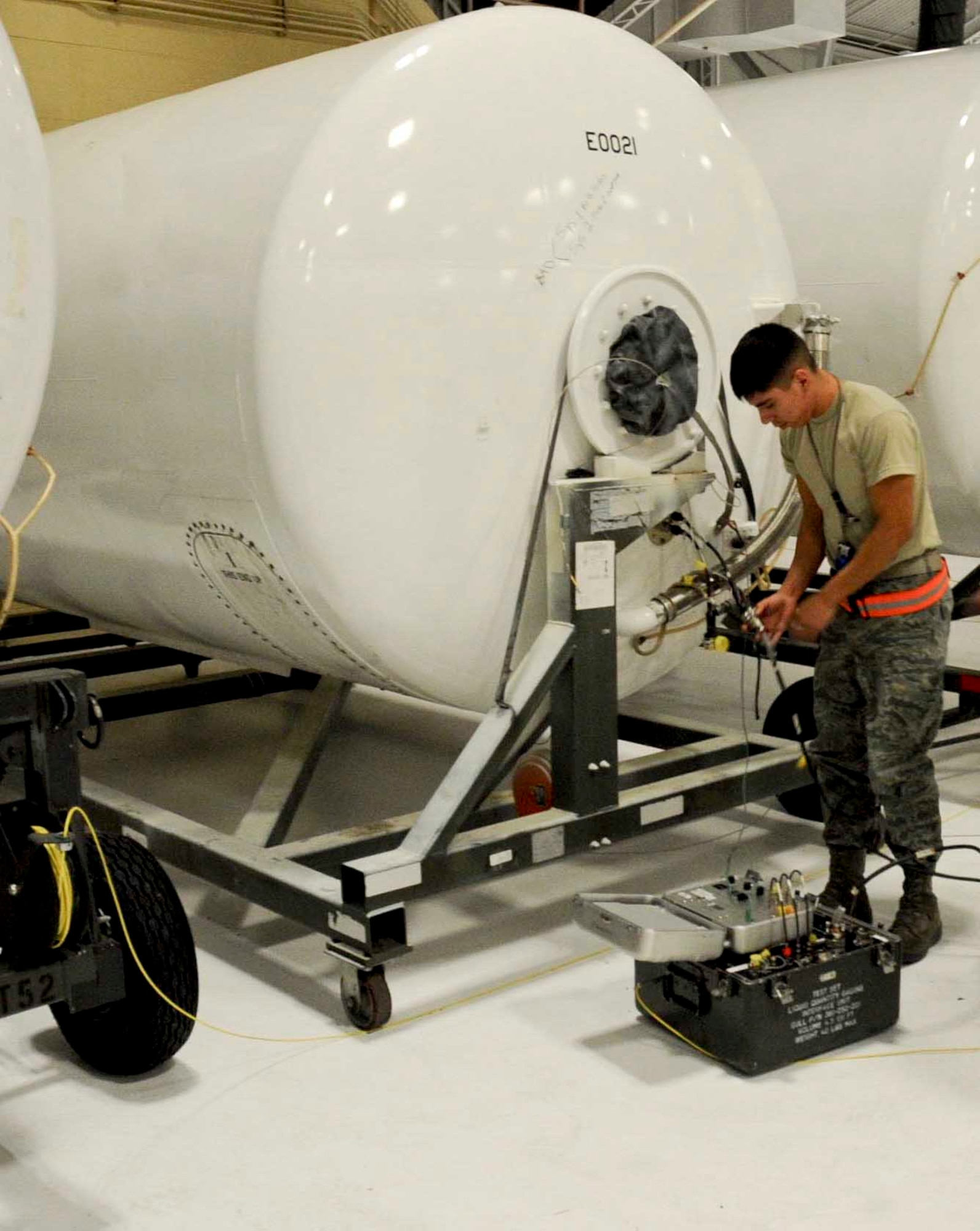 Airman 1st Class Jonathan Rodriguez, 28th Maintenance Squadron fuel systms apprentice, checks the levels in a fuel tank during fuel level testing inside the fuel cell hangar at Ellsworth Air Force Base, S.D., Nov. 8, 2012. Maintaining proper fuel levels is vital to keeping aircraft properly fueled. (U.S. Air Force by Airman 1st Class Anania Tekurio/Released)