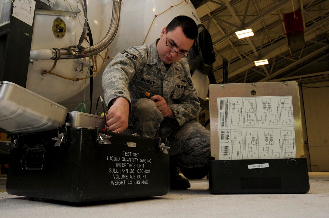 Senior Airman Jonathan Bradey, 28th Maintenance Squadron fuel systems journeyman, prepares a liquid quantity caging interface unit during fuel level testing inside the fuel cell hangar at Ellsworth Air Force Base, S.D., Nov. 8, 2012. Specialists use the LQCI to test internal probes and wires that measure fuel levels inside fuel tanks. (U.S. Air Force photo by Airman 1st Class Anania Tekurio) 