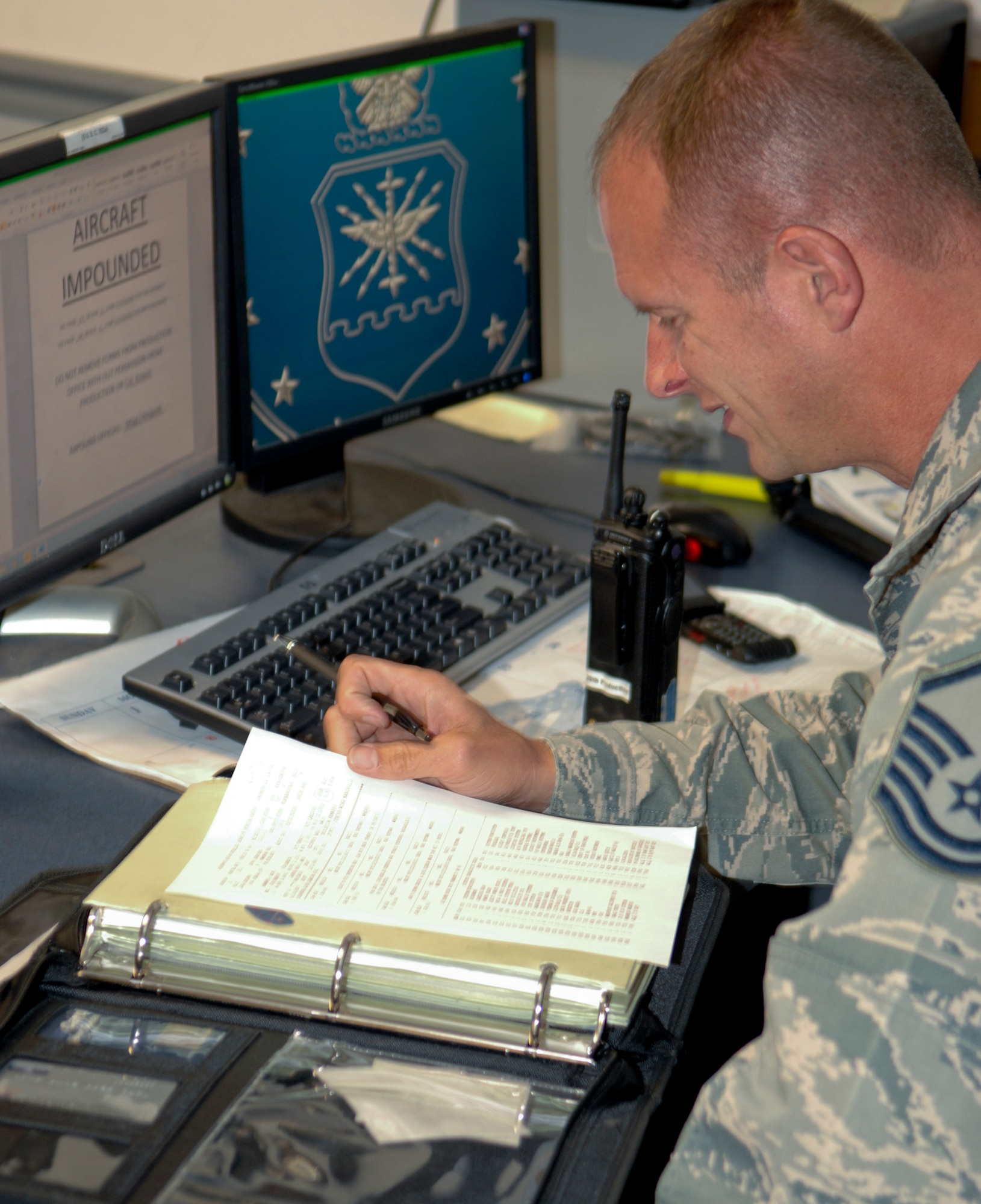 Master Sgt. Jeffrey Richards, 2nd Aircraft Maintenance Squadron production superintendent, reviews aircraft forms to verify what needs to be done on specific aircraft on Barksdale Air Force Base, La., Nov. 6. The 'pro-super' helps to orchestrate different maintenance shop to work together to keep the B-52H Stratofortress flying. (U.S. Air Force photo/ Staff Sgt. Jason McCasland)(RELEASED)