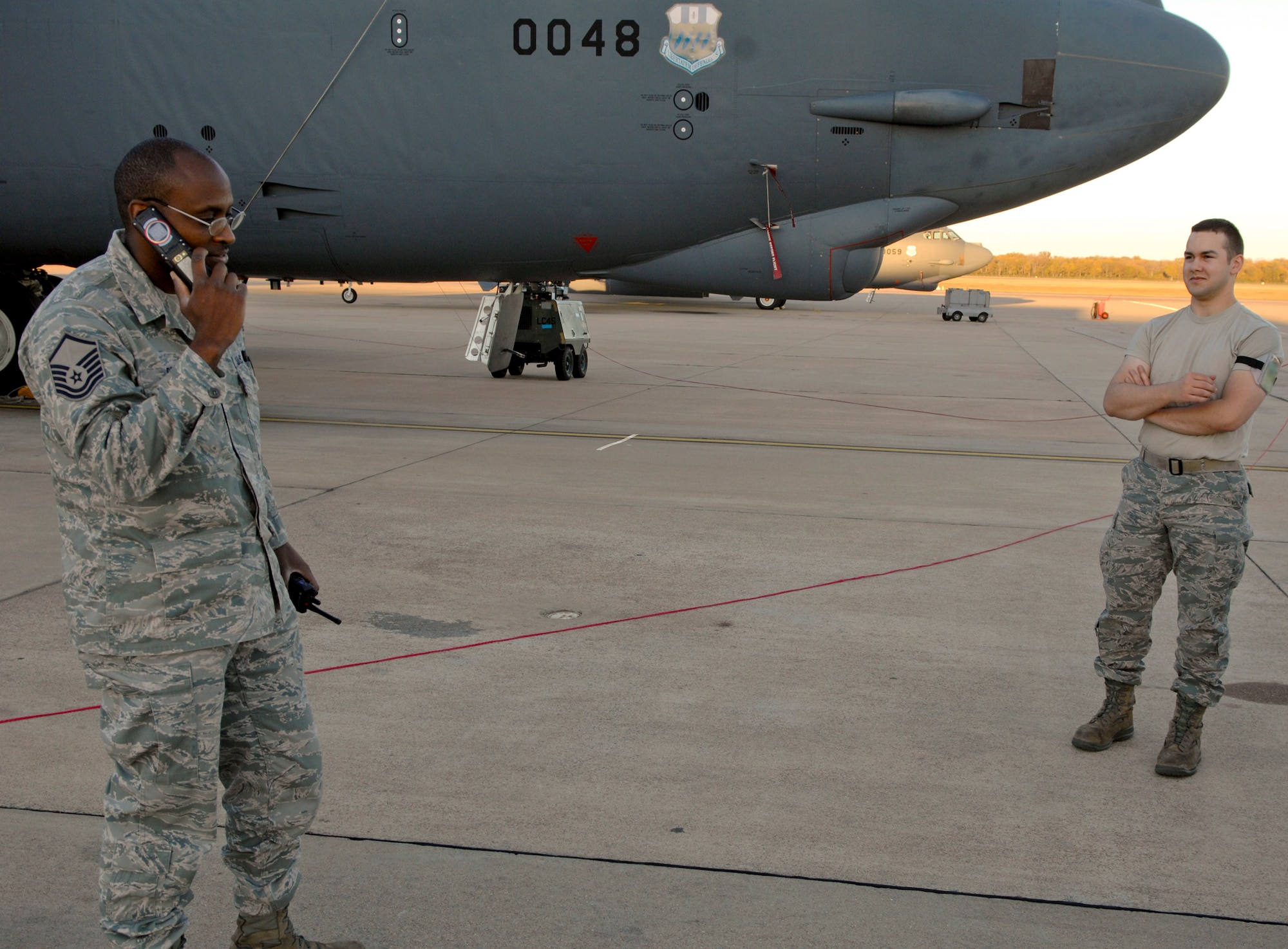 Master Sgt. Michael Reid, 2nd Maintenance Squadron production superintendent, coordinates with members of the 2 MXS Egress shop to get a crane to assist in lowering an ejection seat so the next step in maintenance can be done on Barksdale Air Force Base, La., Nov. 6. The 'pro-super' helps to orchestrate different maintenance shops to work together to keep the B-52H Stratofortress flying. (U.S. Air Force photo/ Staff Sgt. Jason McCasland)(RELEASED)