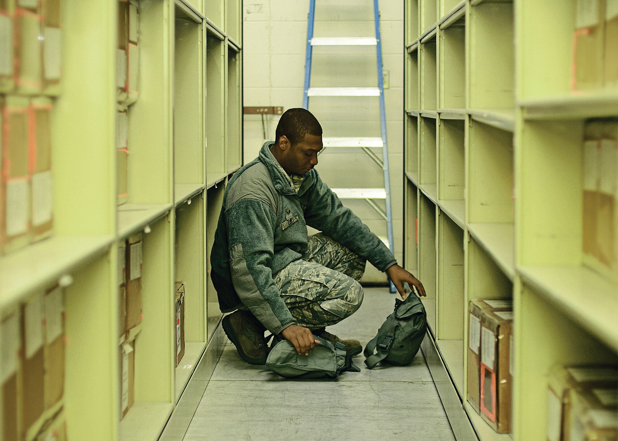 WRIGHT-PATTERSON AIR FORCE BASE, Ohio - Senior Airman Antonio Lee, 445th Logistics Readiness Squadron material management journeyman, conducts an inventory of gas masks during the unit training assembly Oct. 20.  During the last several months, LRS members have been busier than usual preparing for the upcoming operational readiness inspection. (U.S. Air Force photo/Staff Sgt Mikhail Y. Berlin)