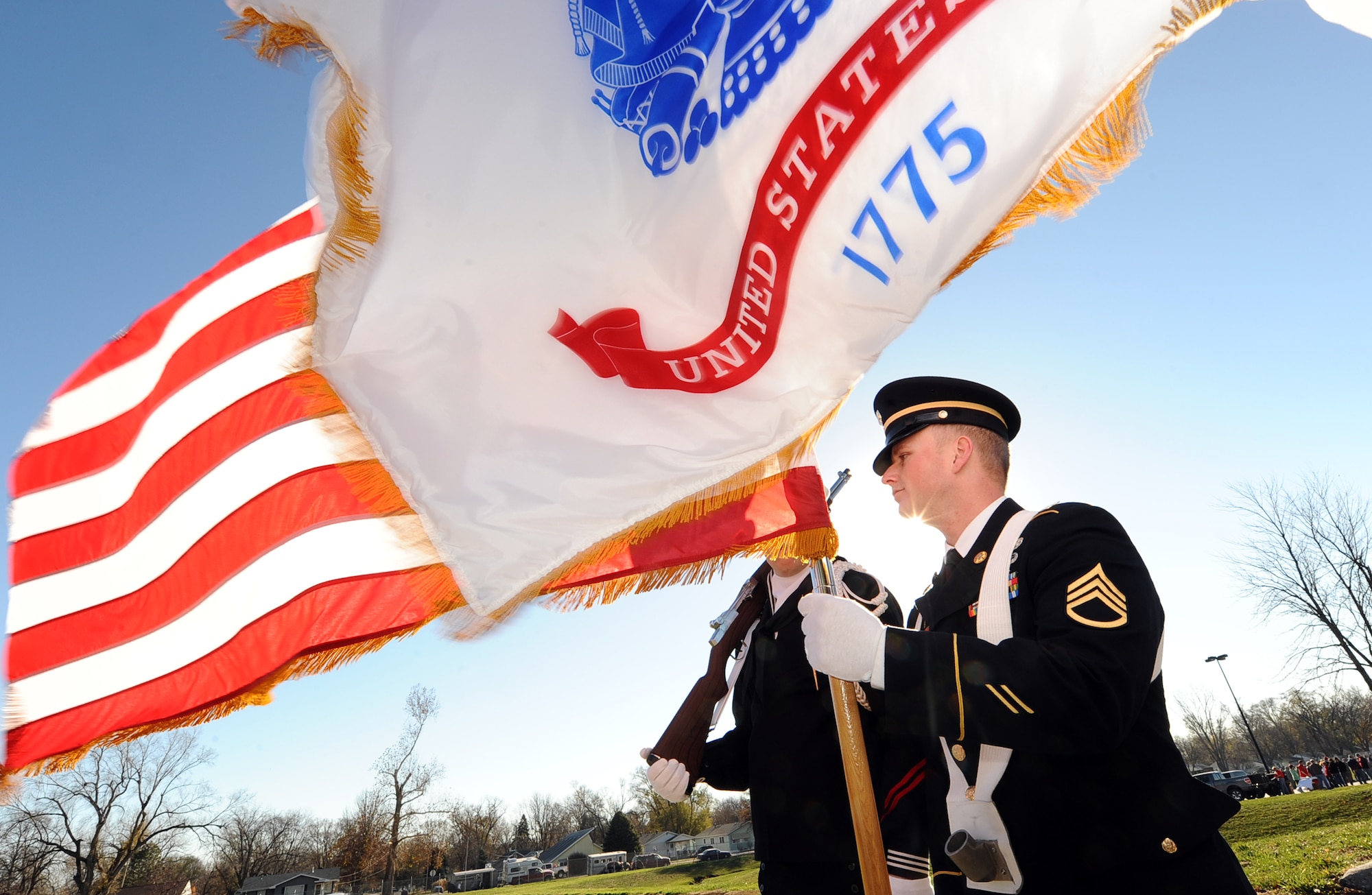 U.S. Army Staff Sgt.  Ralph Pohlman, United States Strategic Command’s Color Guard, holds the U.S. flag to begin the formation for the Veterans Day Parade held in Bellevue, Neb. Nov. 10.  The color guard represents each of the branches of the armed forces and leads the military procession down Mission Avenue.  (U.S. Air Force photo by Josh Plueger/Released)
