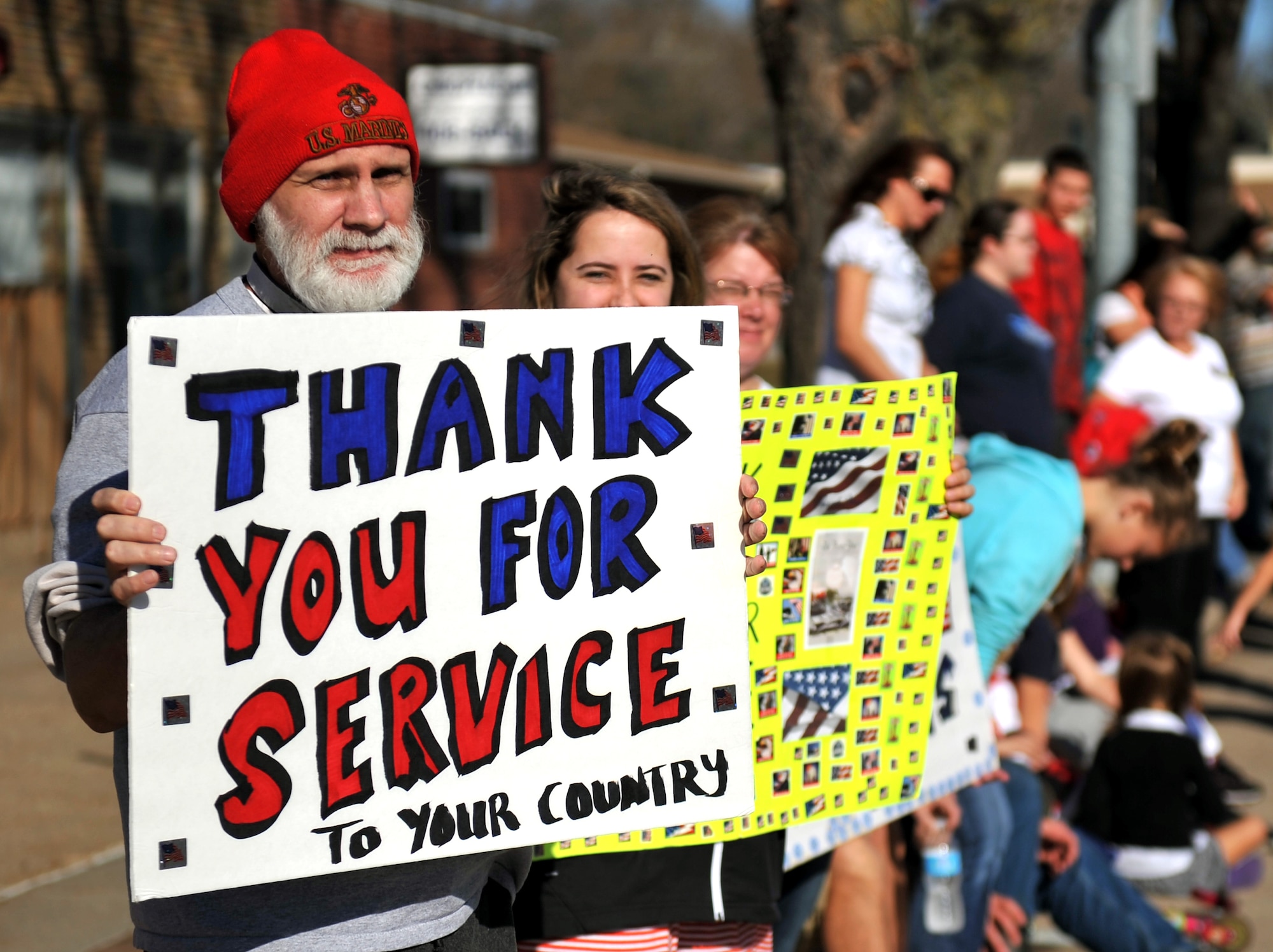 Jim Strawn, a retired U.S. Marine, displays a thank you sign to show his gratitude in the 2012 Veterans Day parade in Bellevue, Neb. Nov. 10. This is the official Veterans Day parade for the state of Nebraska. (U.S. Air Force photo by Jeff W. Gates/Released)