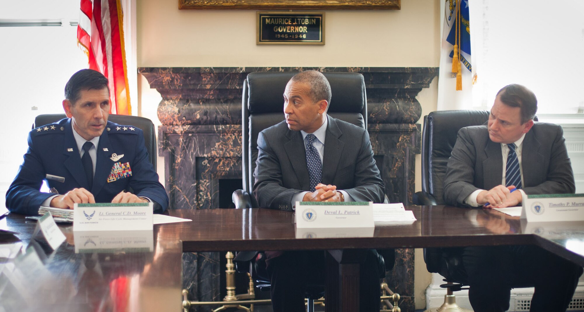 BOSTON – Massachusetts Gov. Deval Patrick (center) and Lt. Gov. Timothy Murray welcome Lt. Gen. C.D. Moore, Air Force Life Cycle Management Center commander, to the Governor's Council Chambers in the State House Nov. 14. Moore visited with leaders from state government, industry and academia to hear about the work they’ve been doing to support Hanscom and to discuss potential collaborative efforts aimed at helping the Air Force meet critical national security objectives. (Courtesy photo by Eric Haynes / Governor's Office)