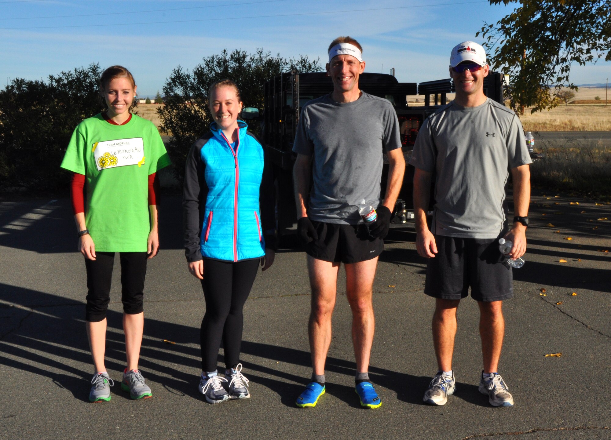 The top two male and female runners from the Turkey Trot 5K pose for picture at Beale Air Force Base, Calif., Nov. 14, 2102. Jessica Clayton(Far left) finished first overall with a time of 18:37. (U.S. Air Force photo by Staff Sgt. Robert M. Trujillo/Released)