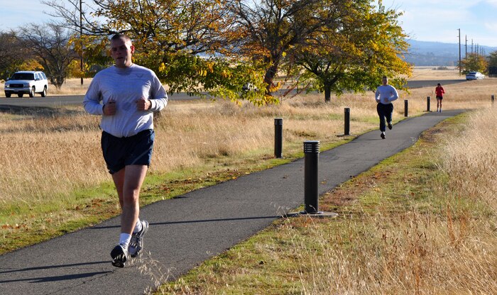 Members of Team Beale run along a path during the Turkey Trot 5K at Beale Air Force Base, Calif., Nov. 14, 2012. More than 30 runners participated in the 9th Force Support Squadron sponsored event. (U.S. Air Force photo by Staff Sgt. Robert M. Trujillo/Released)