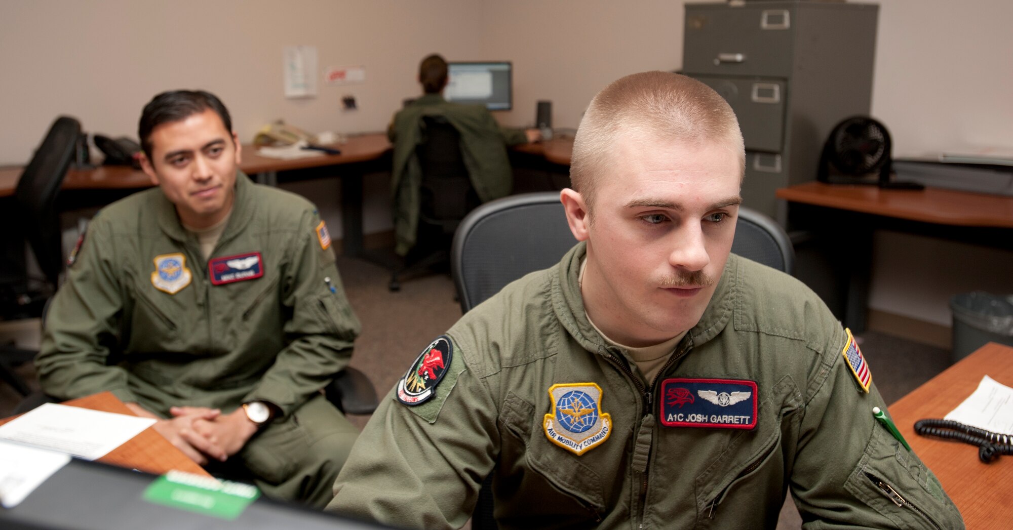 Airman 1st Class Joshua Garrett, 350th Air Refueling Squadron boom operator, reviews 1st Lt. Mike Burns’, 350th ARS copilot, mobility folder Nov. 15, 2012, McConnell Air Force Base, Kan. Garrett was chosen as the 22nd Air Refueling Wing spotlight performer for the week of Nov. 5 to 9. (U.S. Air Force photo/Airman 1st Class Victor J. Caputo)