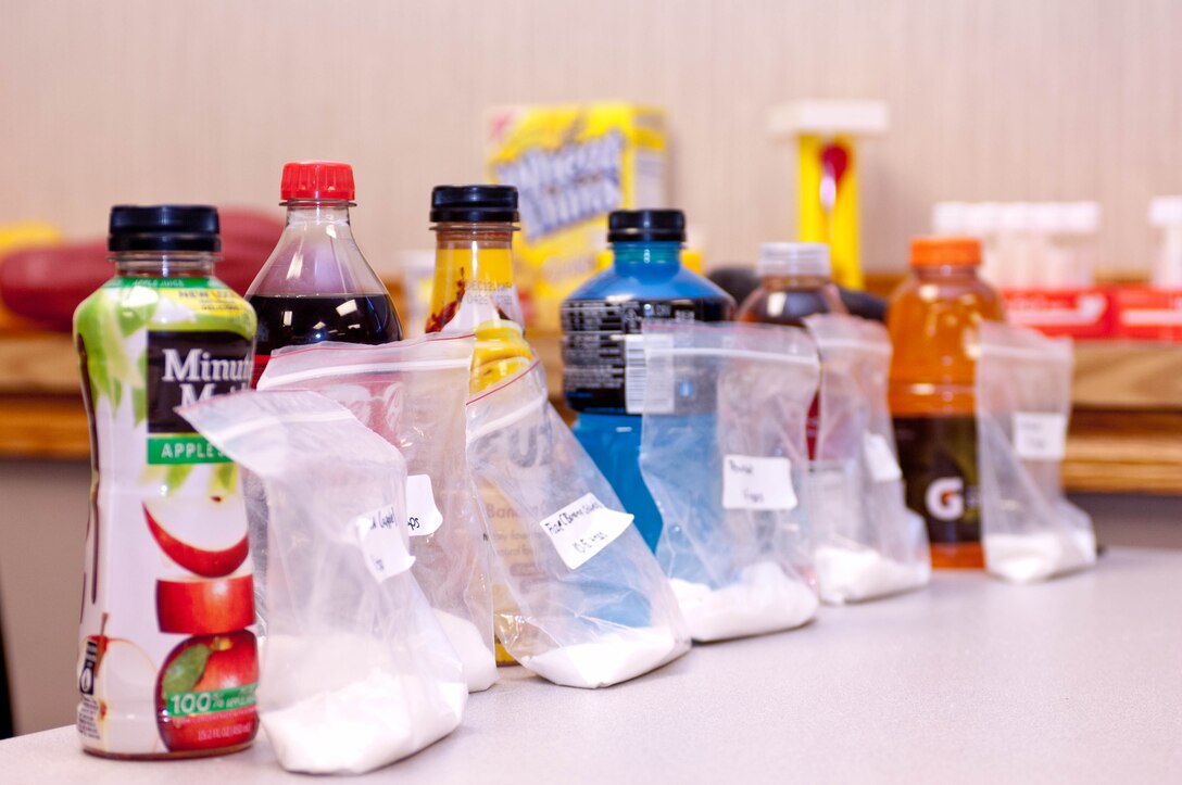 The amount of sugar content in popular beverages is displayed during the “Better Body, Better Life” course at the Health and Wellness Center on Ellsworth Air Force Base, S.D., Nov. 8, 2012.  The course is designed to give attendees an in-depth knowledge of nutrition to guide them in smarter decisions with the food they consume. (U.S. Air Force Photo by Airman 1st Class Audra M. Hornbacher/Released)