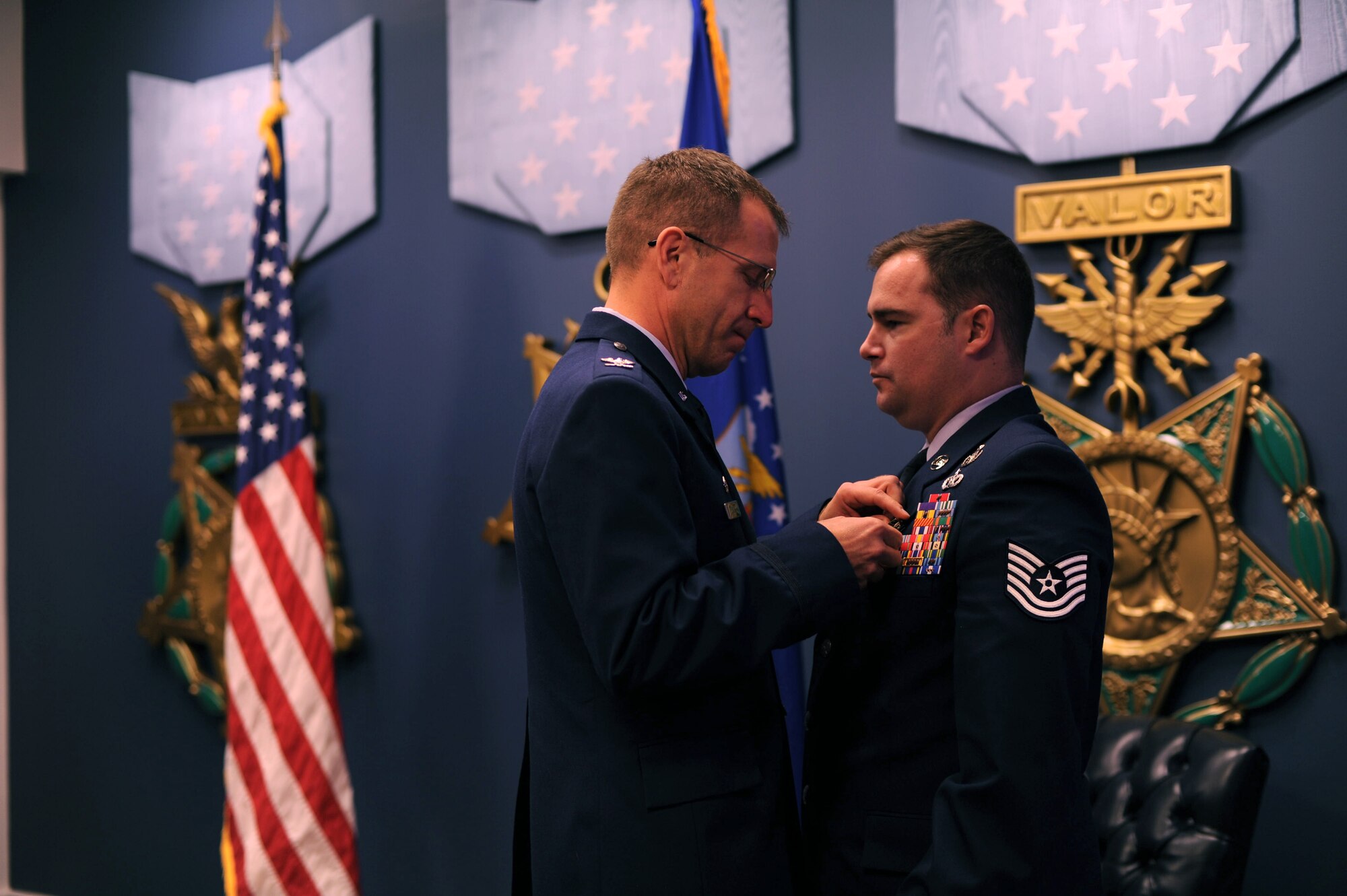 Col. Jim Slife, commander 1st Special Operations Wing, pins a Silver Star on Tech. Sgt. Joseph Deslauriers, an explosive ordnance disposal technician from the 1st Special Operations Civil Engineer Squadron, during a ceremony at the Pentagon, Nov. 14, 2012. Deslauriers earned the medal for gallantry in action while serving in Afghanistan Sep. 23, 2012. (U.S. Air Force Photo/Airman 1st Class Hayden K. Hyatt)