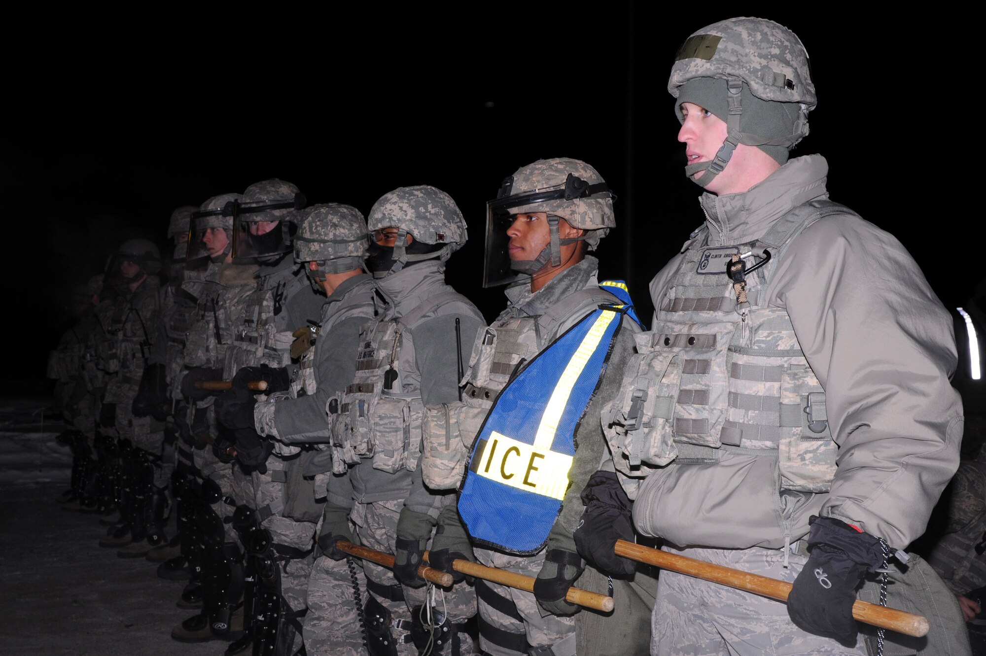Icemen assigned to the 354th Security Forces Squadron hold their ground during an operational readiness exercise Nov. 7, 2012, Eielson Air Force Base, Alaska. During the ORE, SFS members were tested as they respond to a simulated protest. (U.S. Air Force photo/Staff Sgt. Jim Araos)