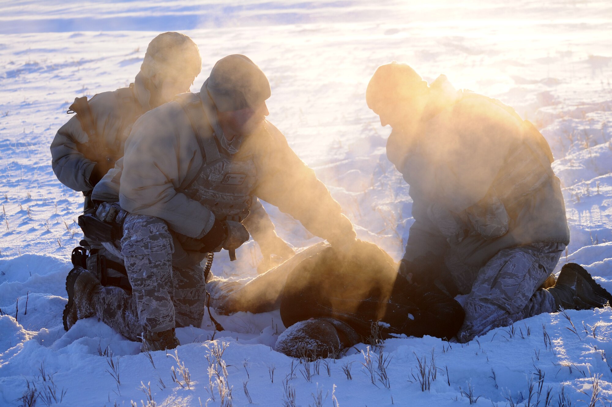 Icemen assigned to the 354th Security Forces Squadron apprehend a suspect during an operational readiness exercise Nov. 7, 2012, Eielson Air Force Base, Alaska. During the ORE, Icemen reacted to a simulated unauthorized taxi on the flightline to test overall readiness. (U.S. Air Force photo/Staff Sgt. Jim Araos)