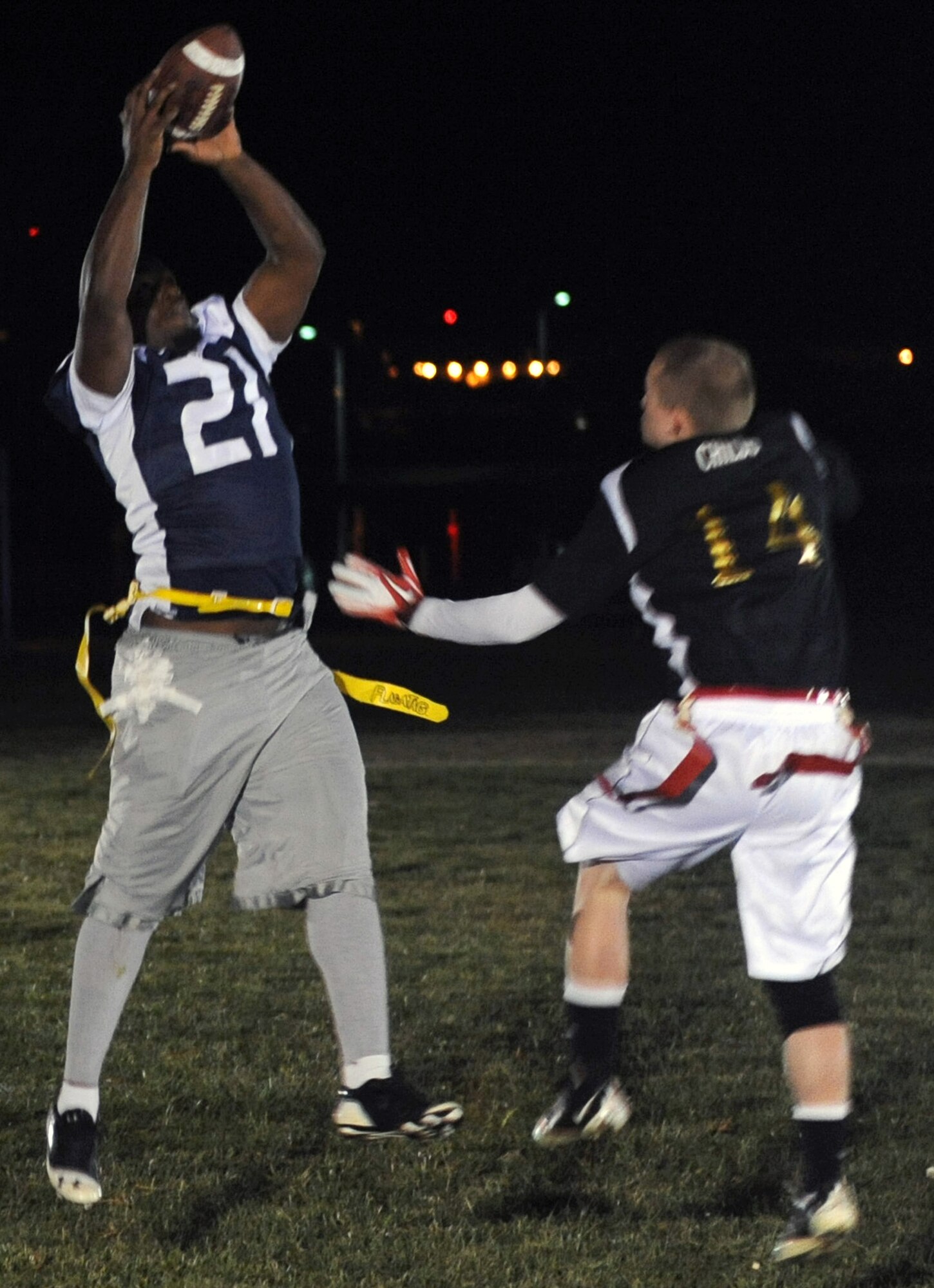 Jesse Cooks, 509th AMXS wide receiver, catches a pass during the 2012 Flag Football Championship game Nov. 13 at Whiteman Air Force Base, Mo. The 509th Aircraft Maintenance Squadron  won the championship for the third straight year, defeating the 509th Force Support Squadron 24-16. (U.S. Air Force photo/Airman 1st Class Bryan Crane)